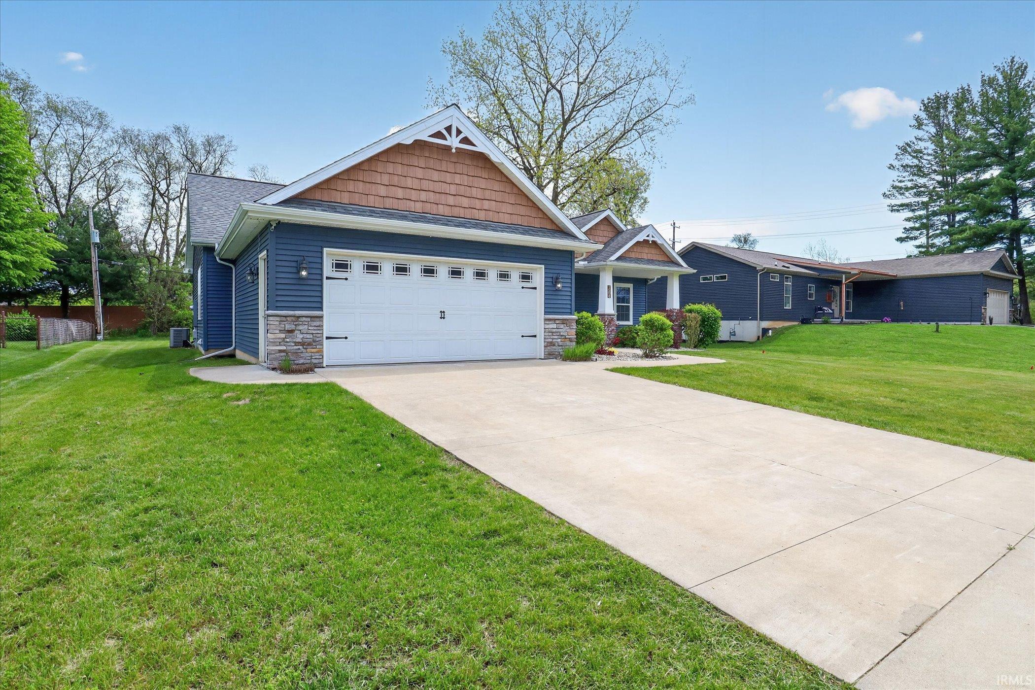 Two-car garage with a concrete driveway