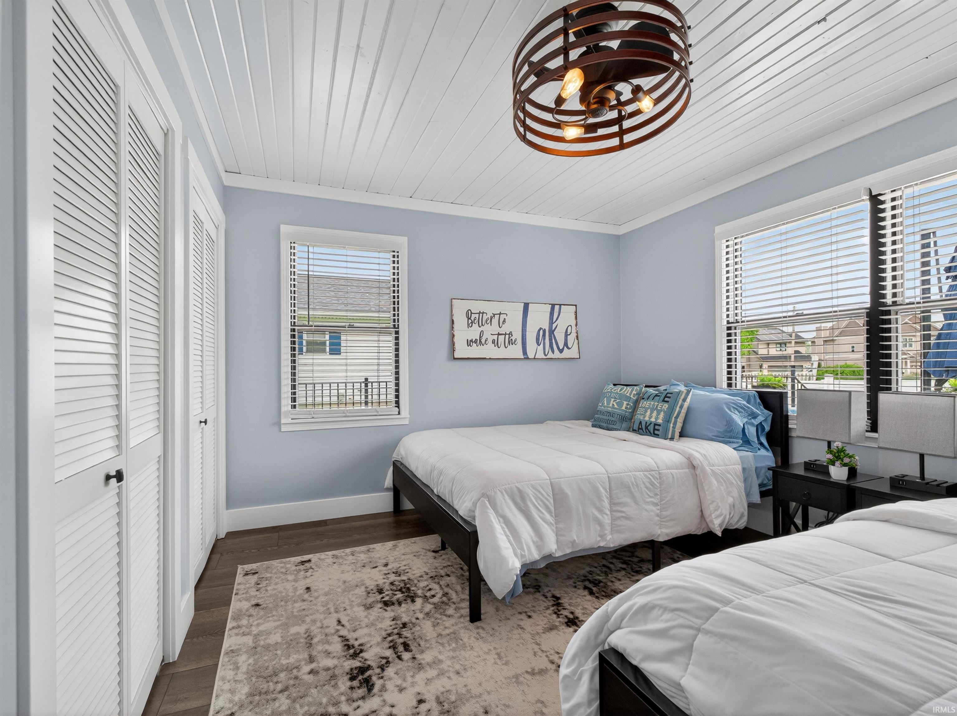 Light blue walls with white baseboards and crown molding