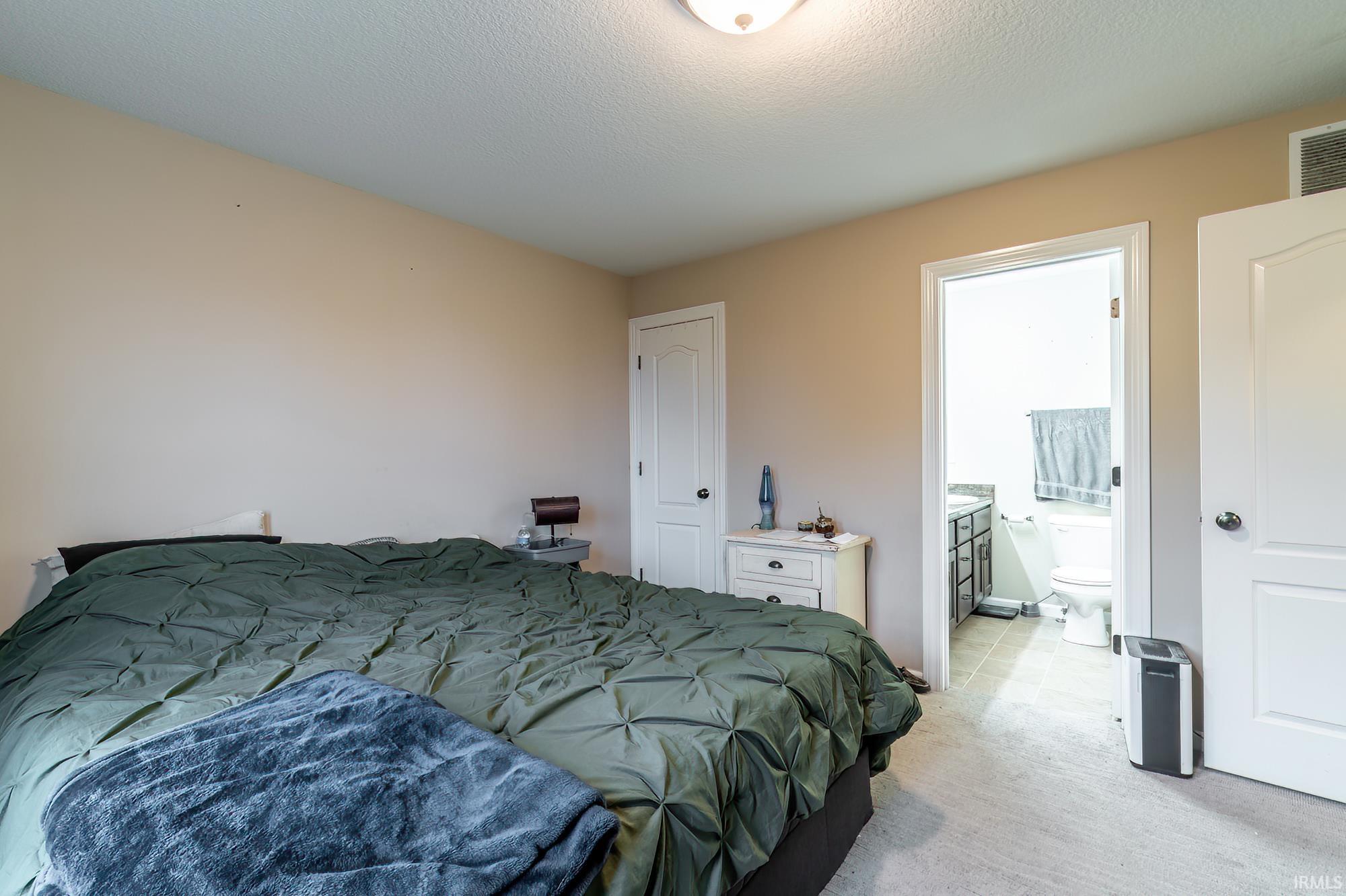 Bedroom featuring carpet flooring and neutral wall tones