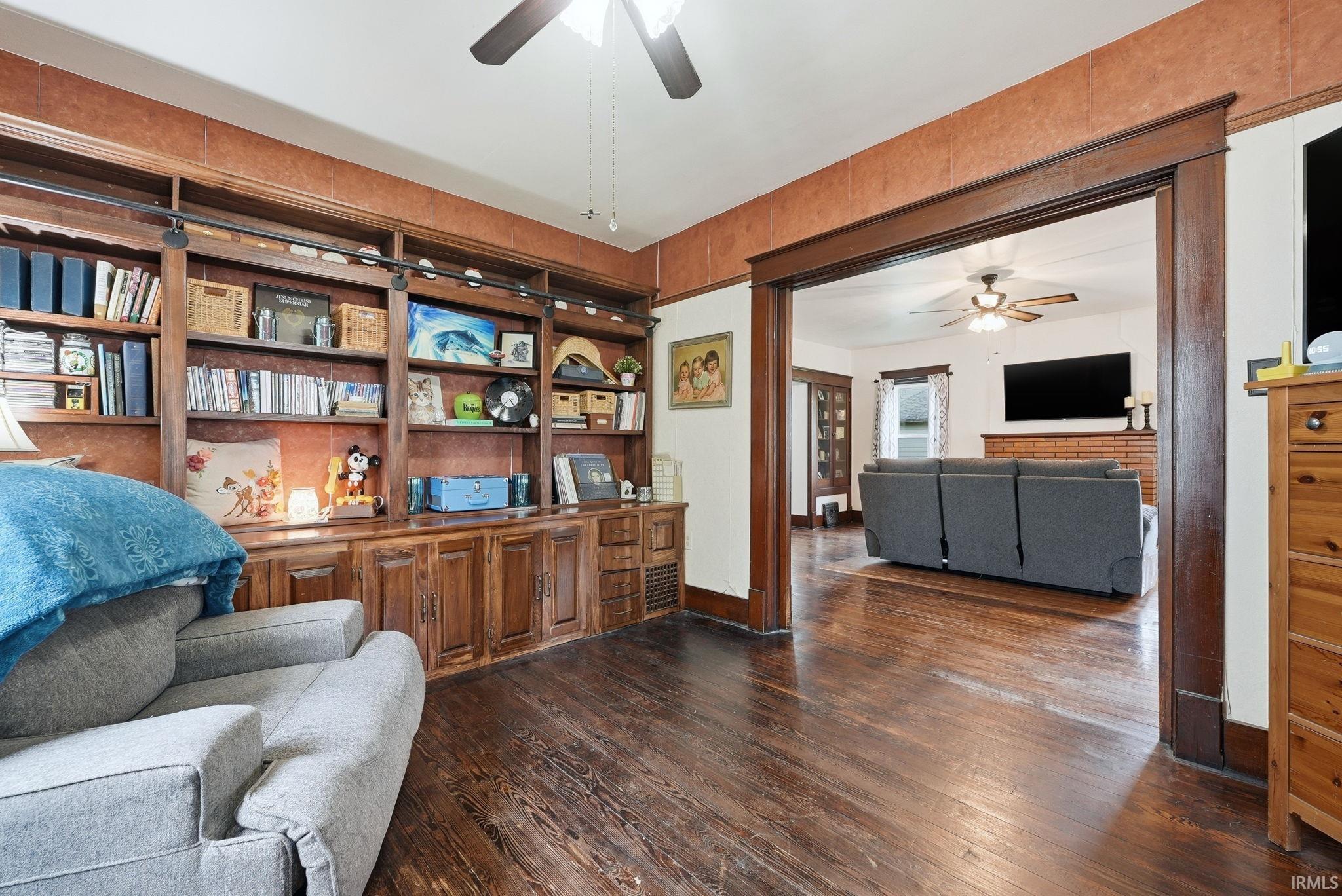 Built-in wood cabinetry and shelving with integrated lighting
