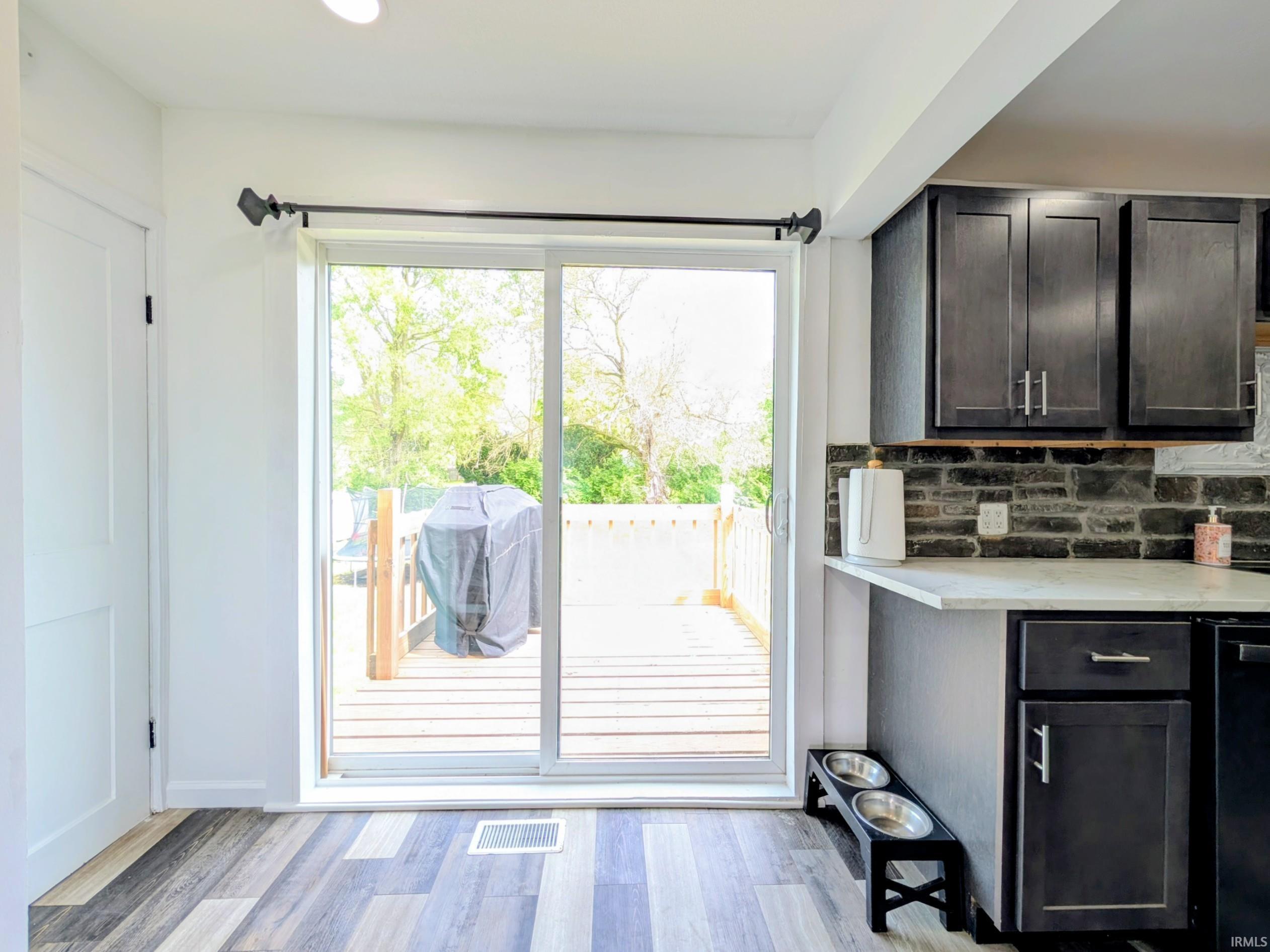 Sliding glass door leading to an outdoor deck