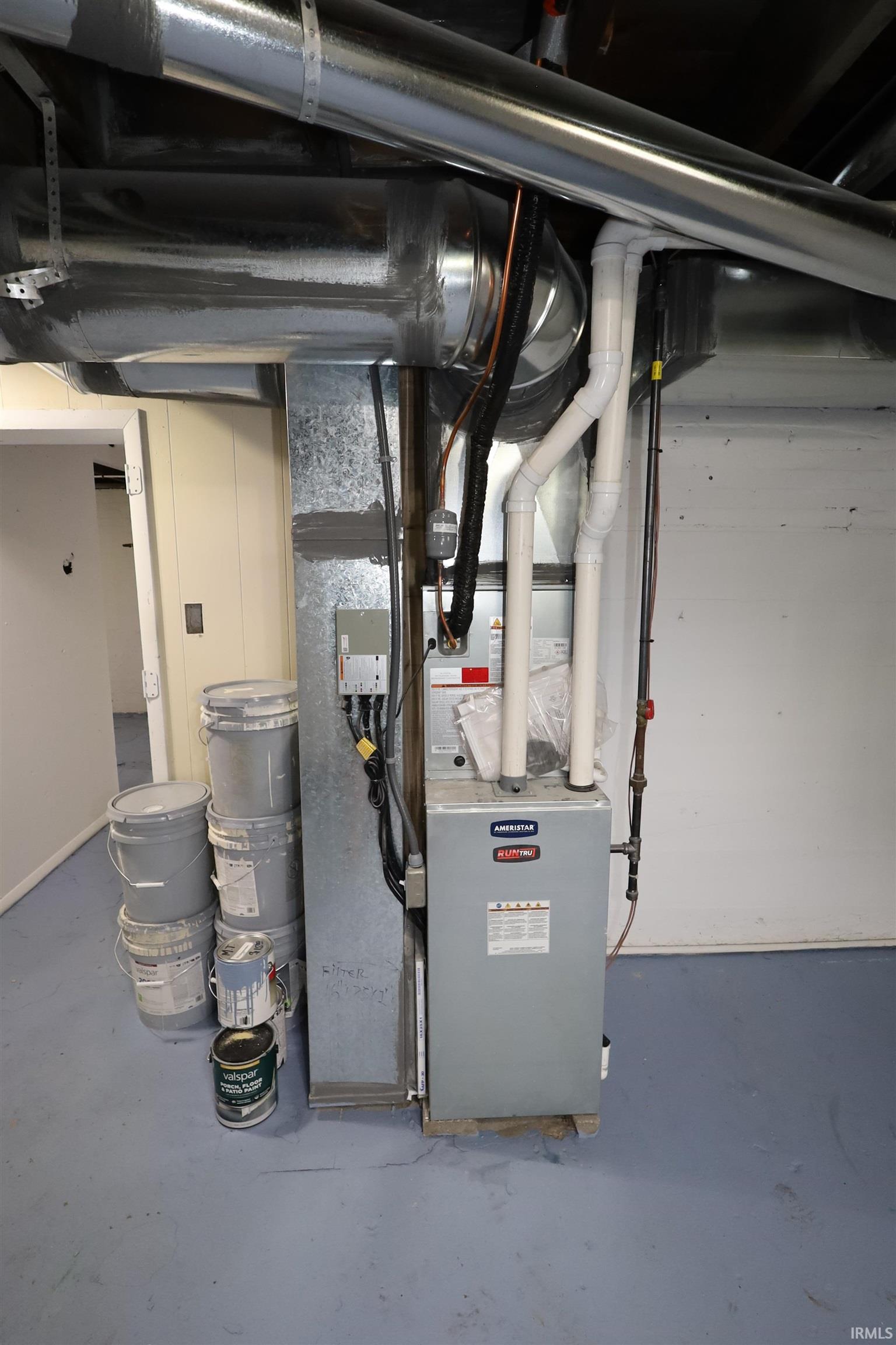 Forced air furnace system with associated ductwork and piping
