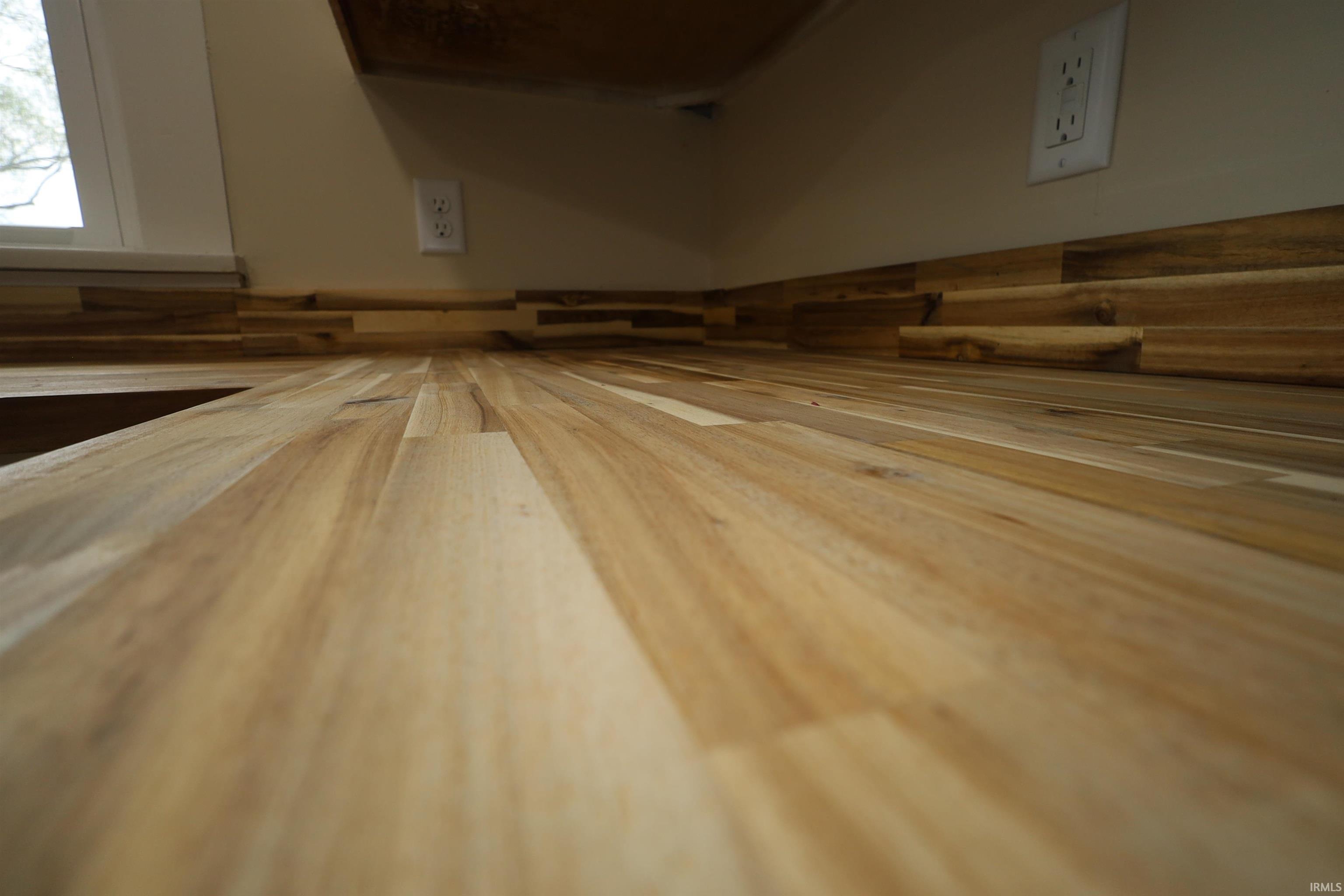 Butcher block countertop with an integrated wood-paneled backsplash