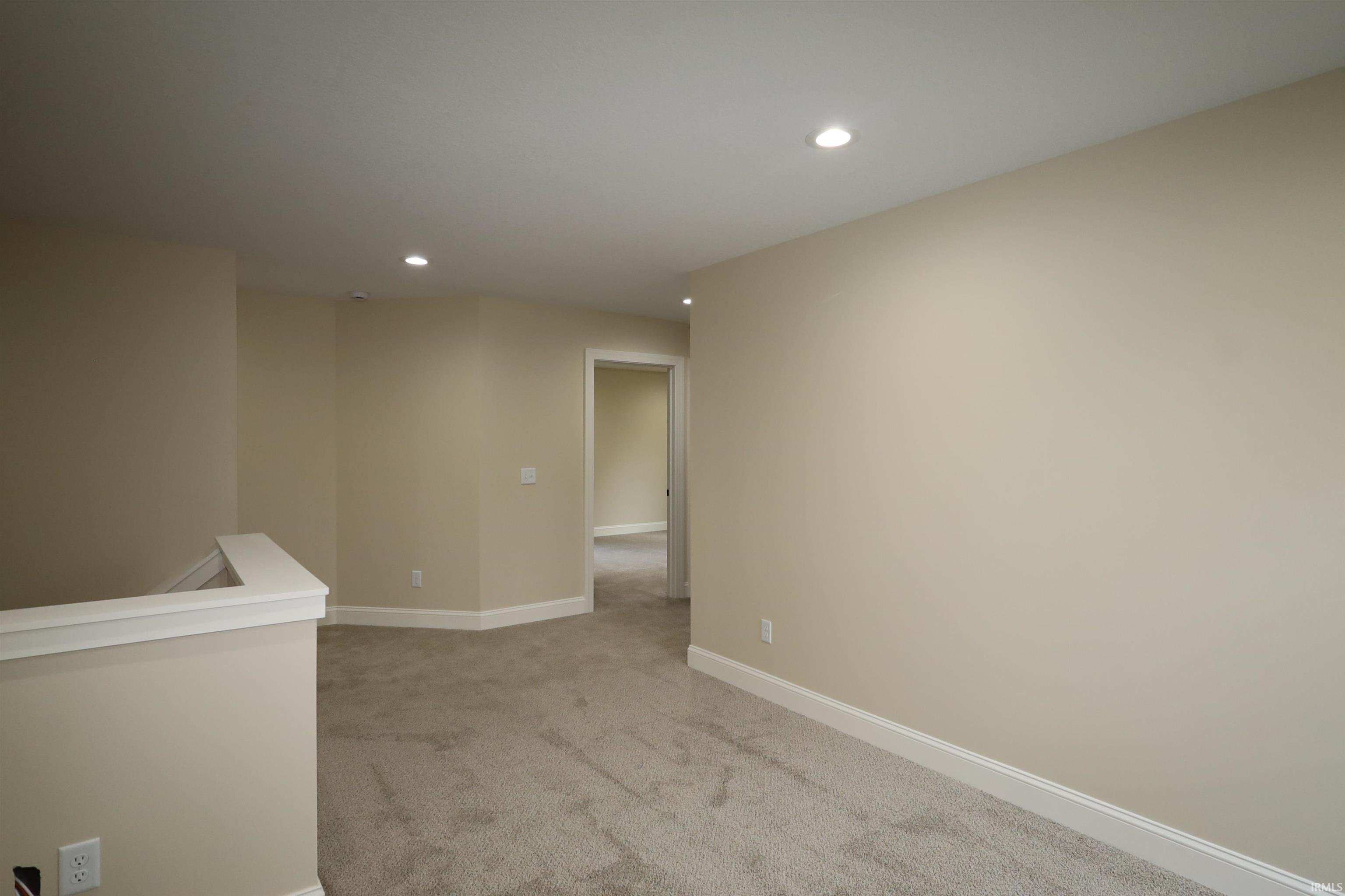 Neutral-toned carpet flooring throughout