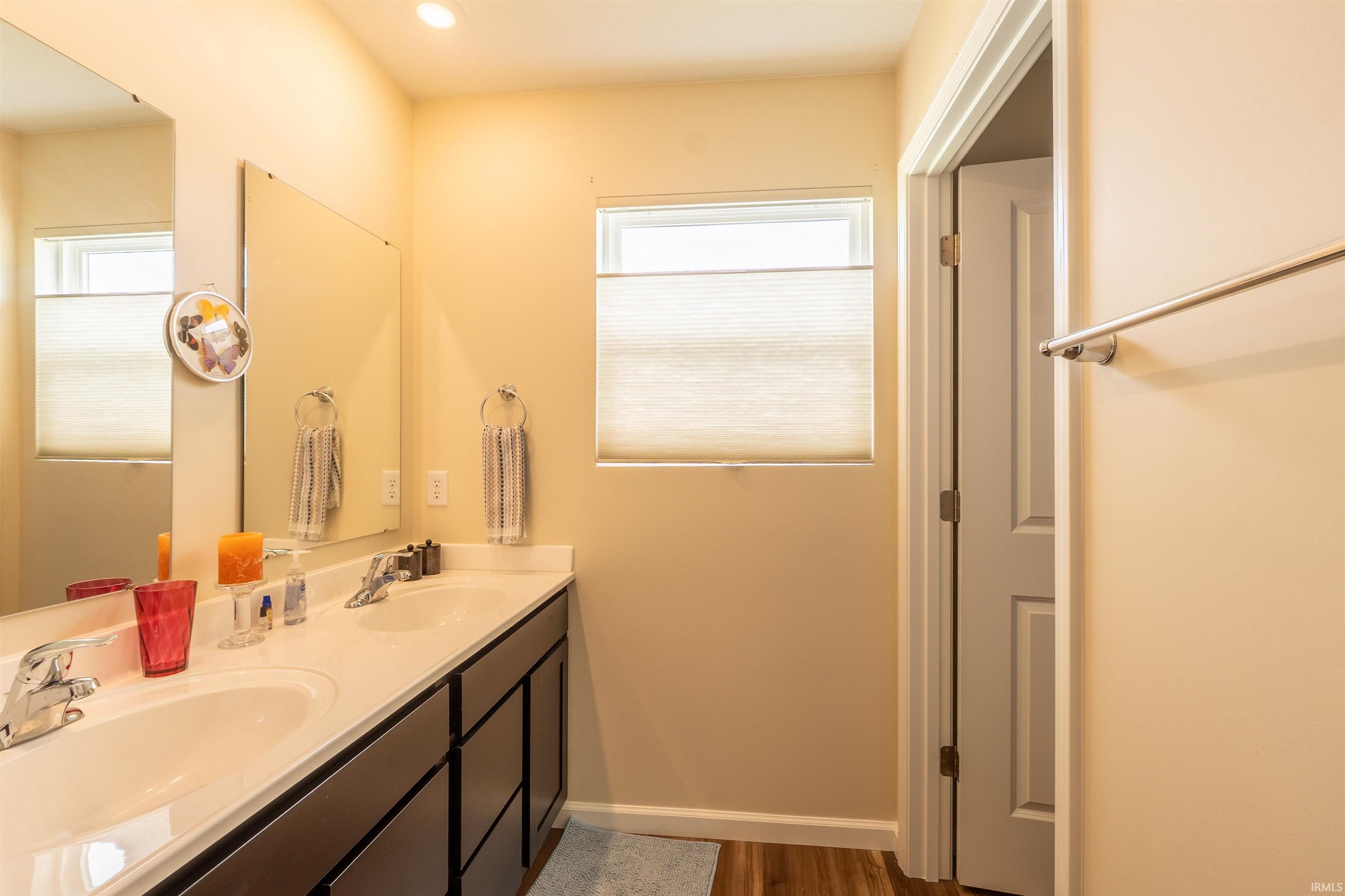 Dual vanity with integrated sinks and chrome fixtures