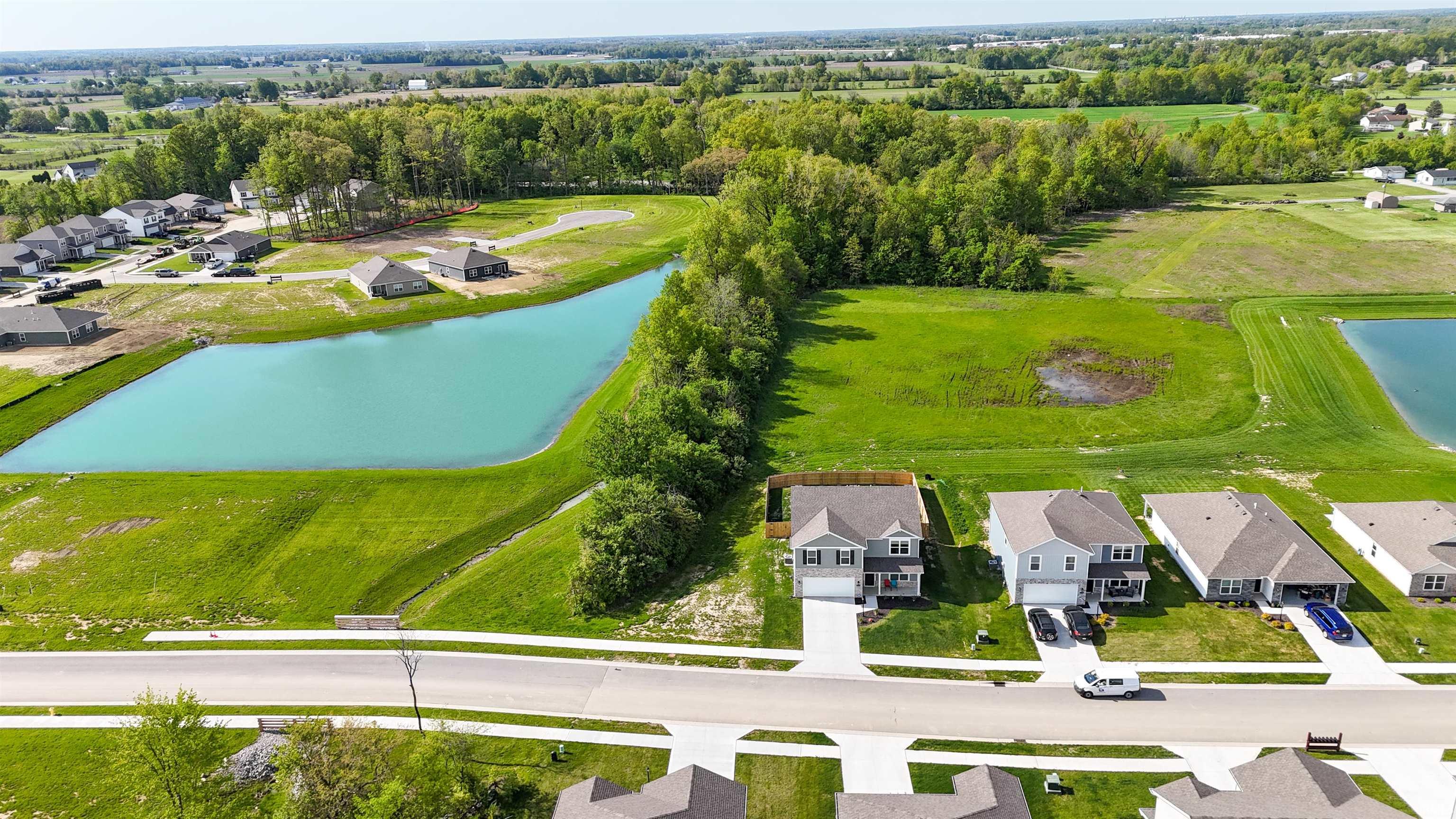 Newly constructed residential properties featuring well-maintained front yards and concrete driveways