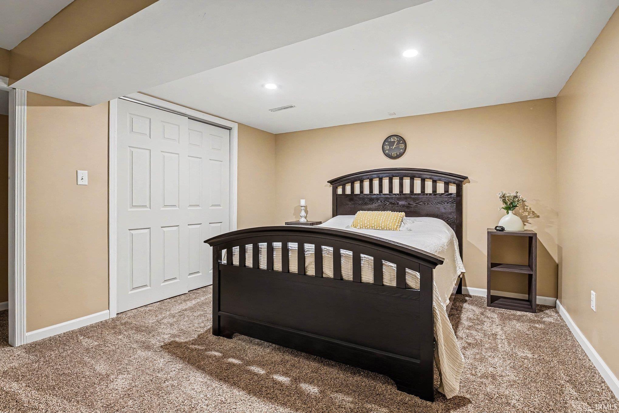 Interior room featuring neutral-toned walls and plush carpeting