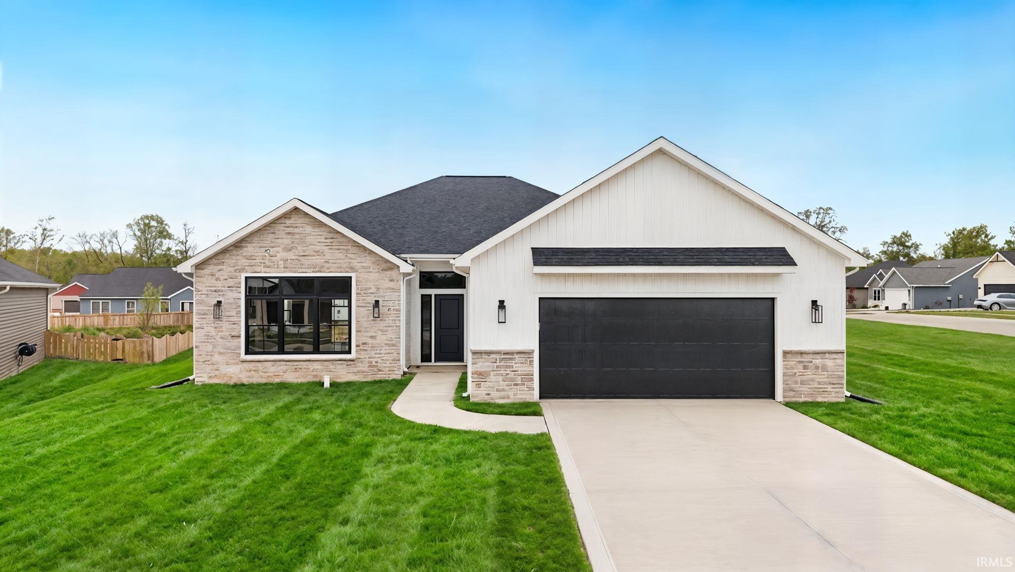 Modern ranch-style residence featuring stone and vertical siding accents