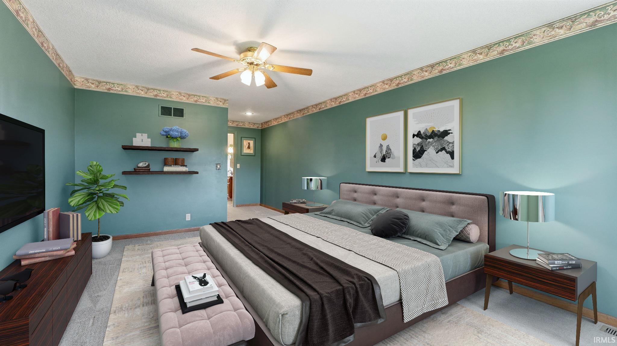Spacious room featuring a ceiling fan with integrated lighting, recessed wall shelving, wood-finish flooring, and a decorative border