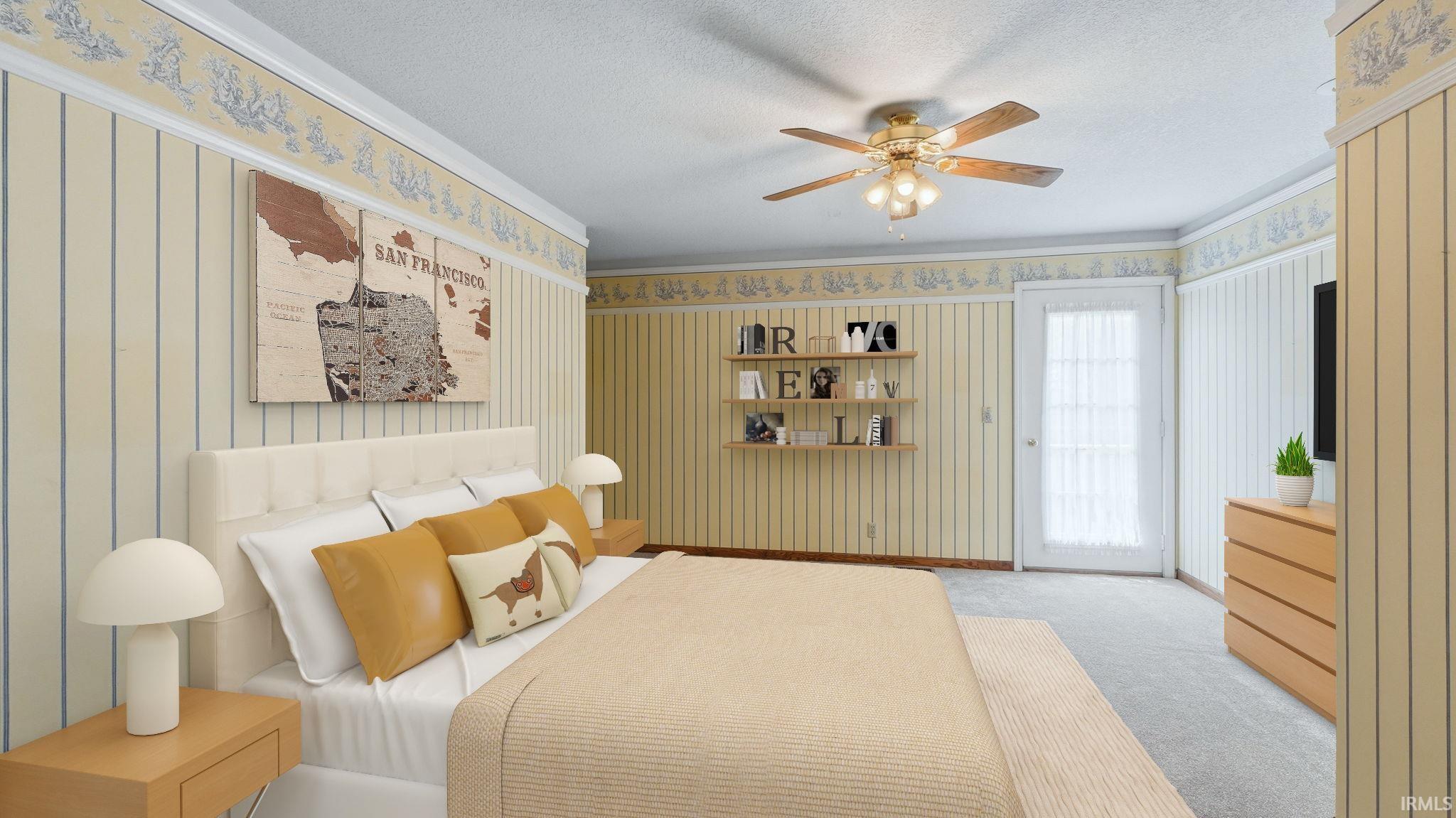 Carpeted bedroom featuring a ceiling fan with light fixture, decorative wall paneling, and an exterior door with privacy blinds