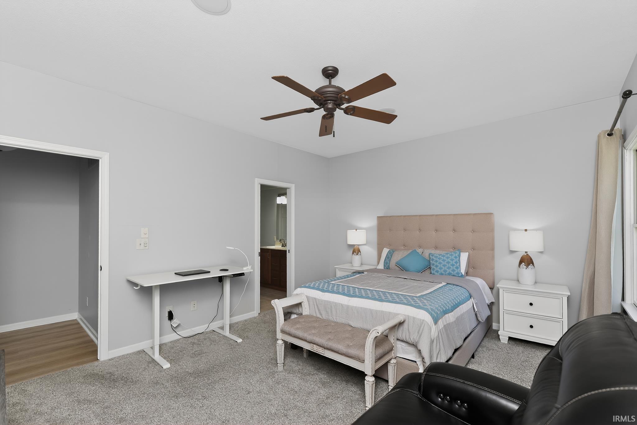 Carpeted room with light gray walls, a ceiling fan, and a recessed ceiling light