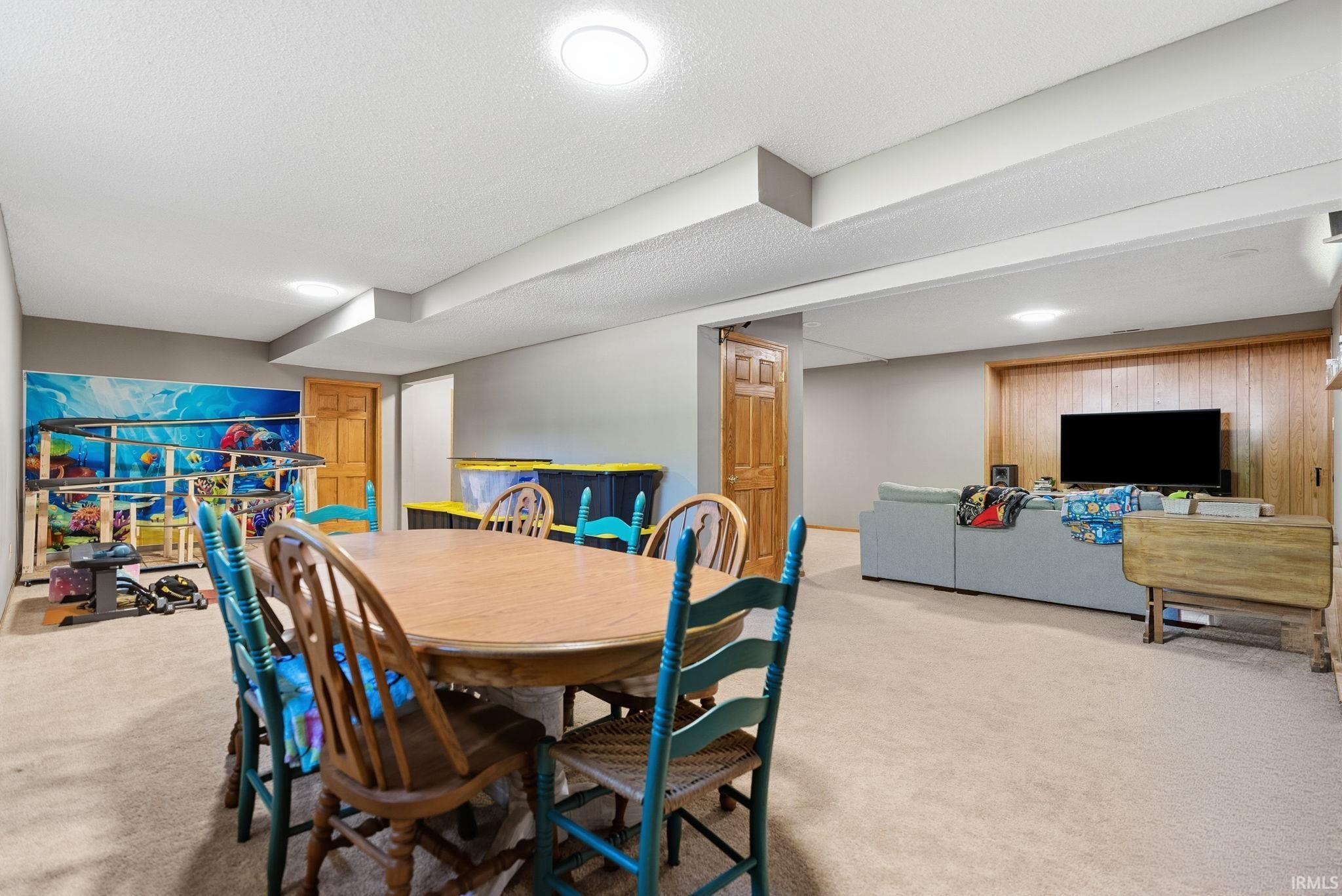 Expansive lower-level space featuring carpeted flooring and recessed lighting