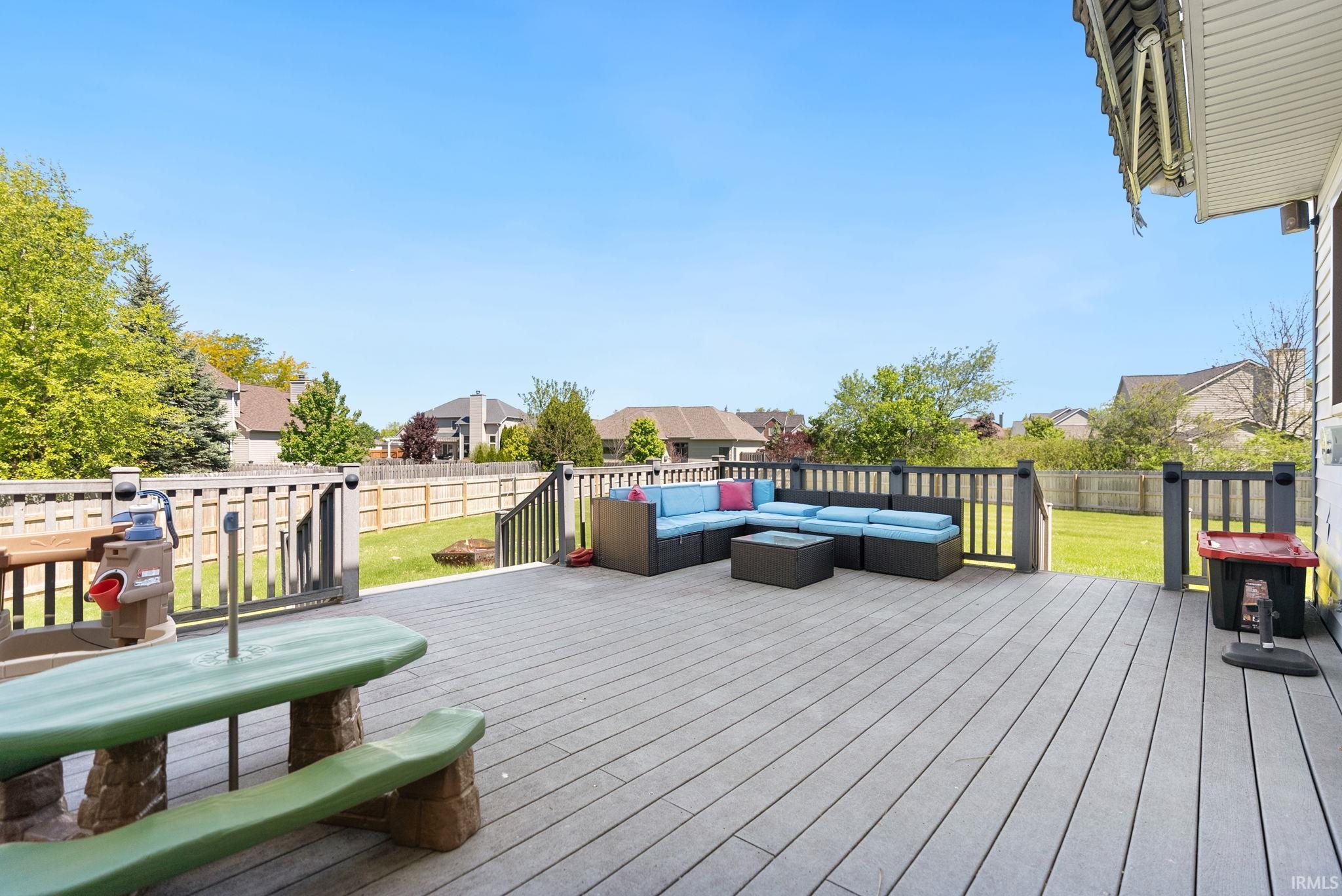Spacious composite deck with dark railings and a light gray surface