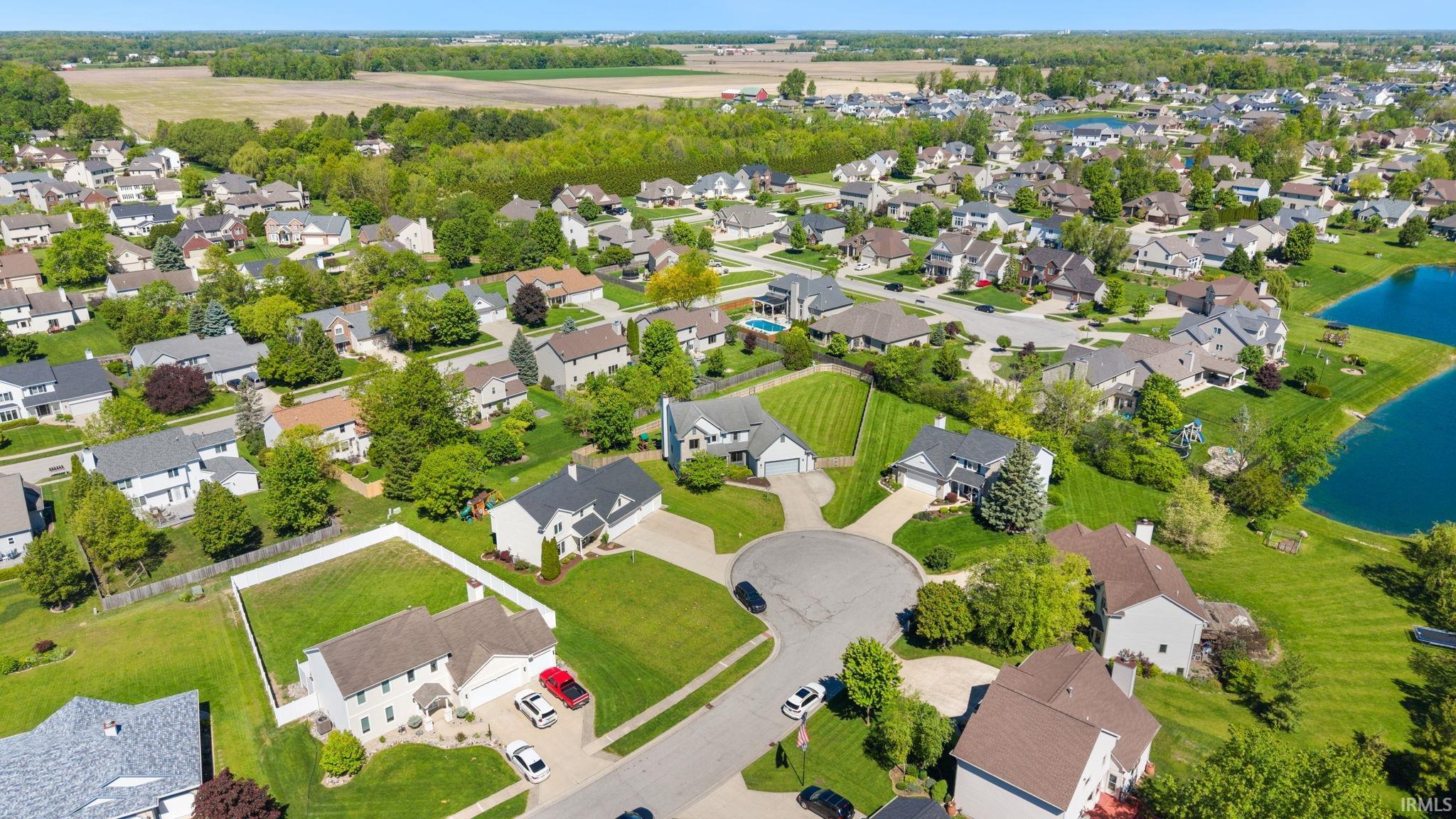 Expansive residential community featuring mature landscaping, diverse architectural styles, and multiple private ponds