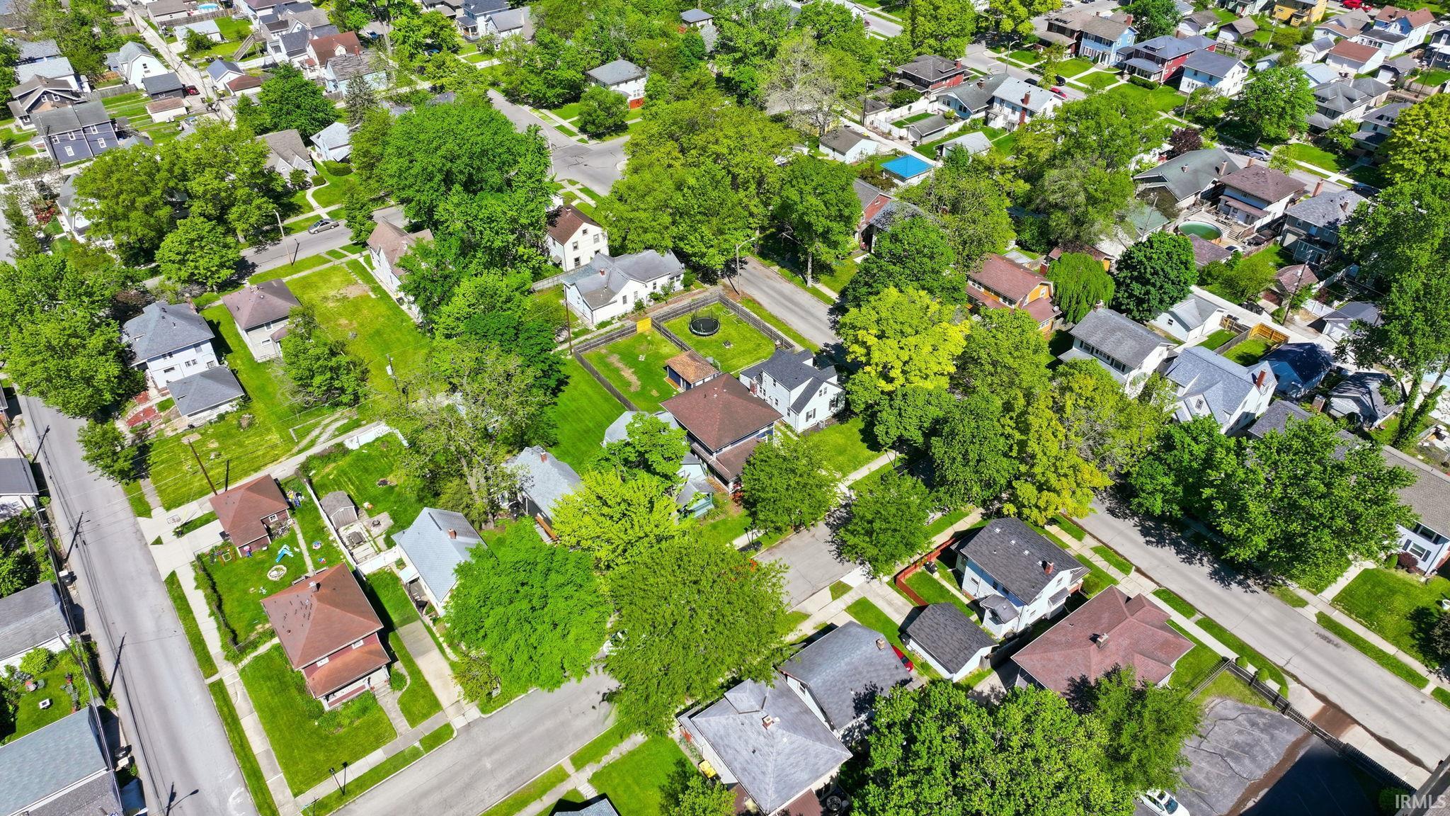 Residential neighborhood featuring a grid street pattern and numerous mature trees