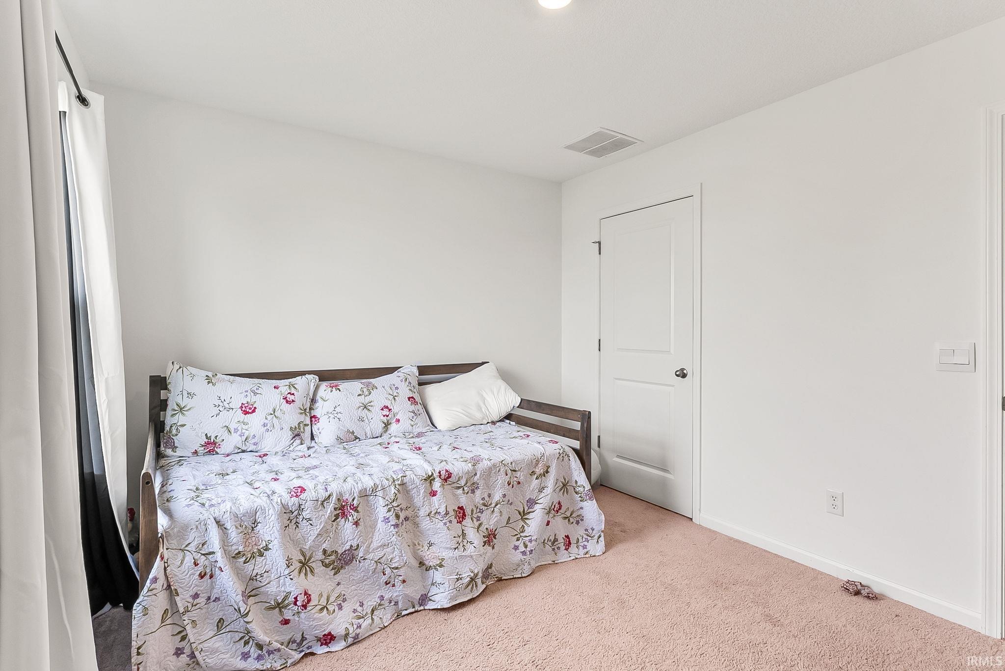 Neutral wall color with a window providing natural light