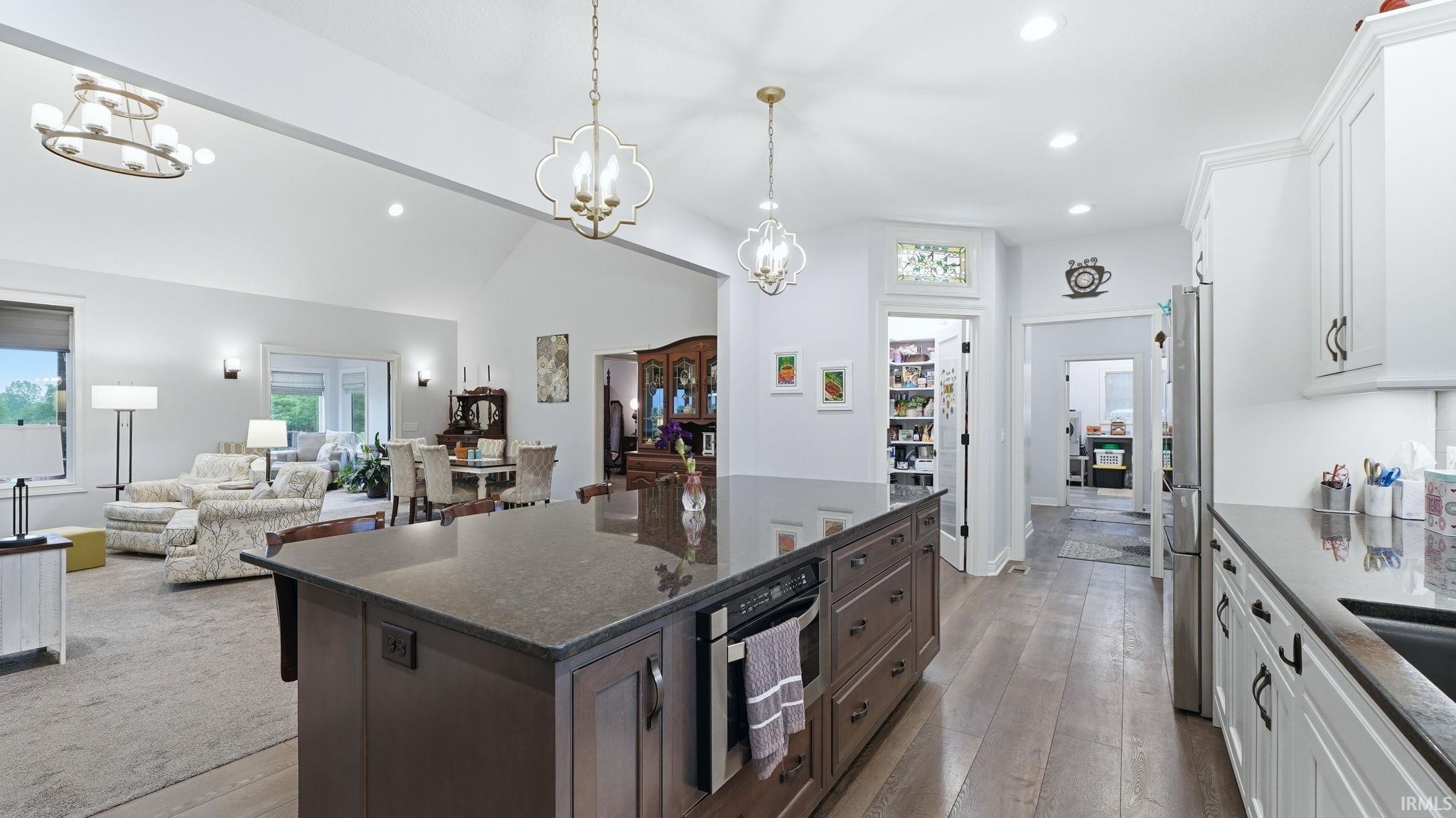 Spacious kitchen featuring a large center island with a dark countertop, and stainless-steel appliances