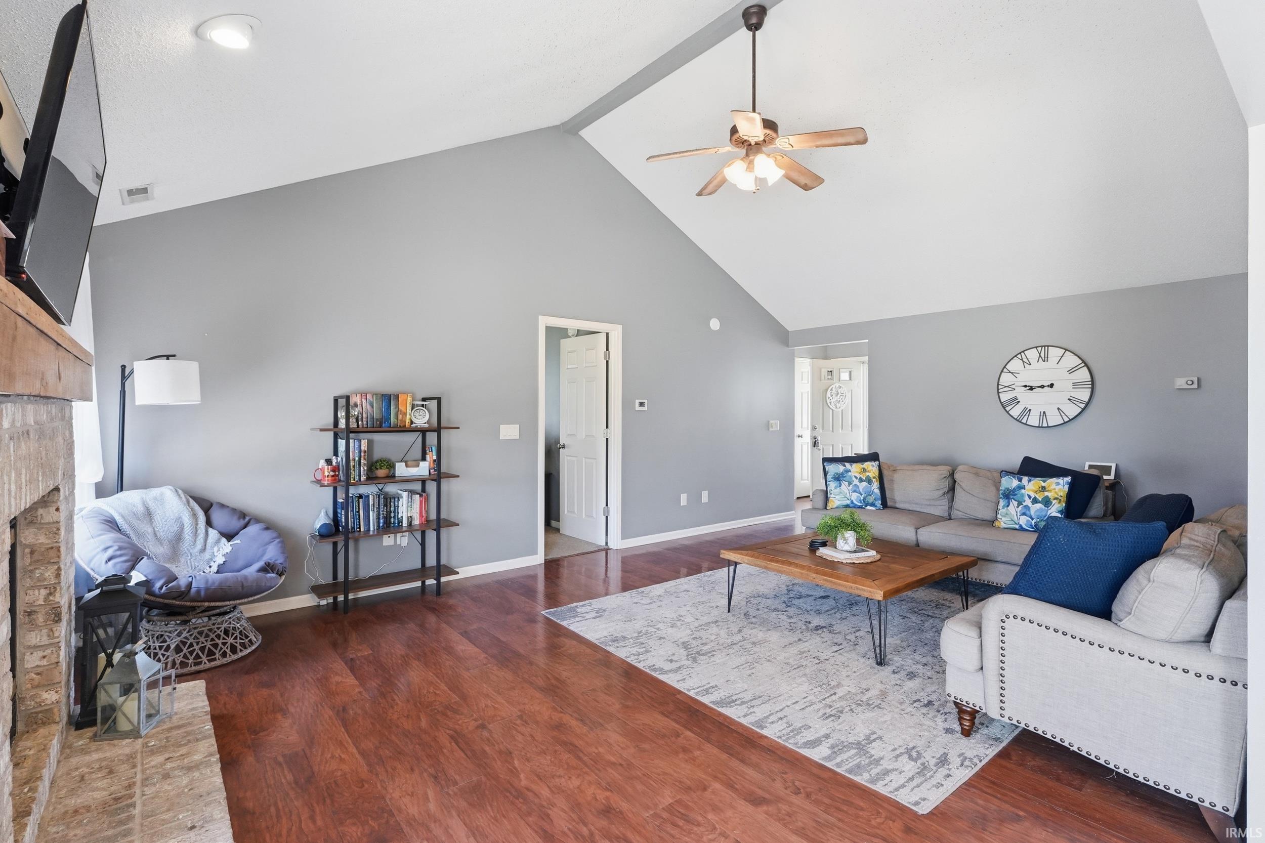 Vaulted ceiling with a ceiling fan and recessed lighting