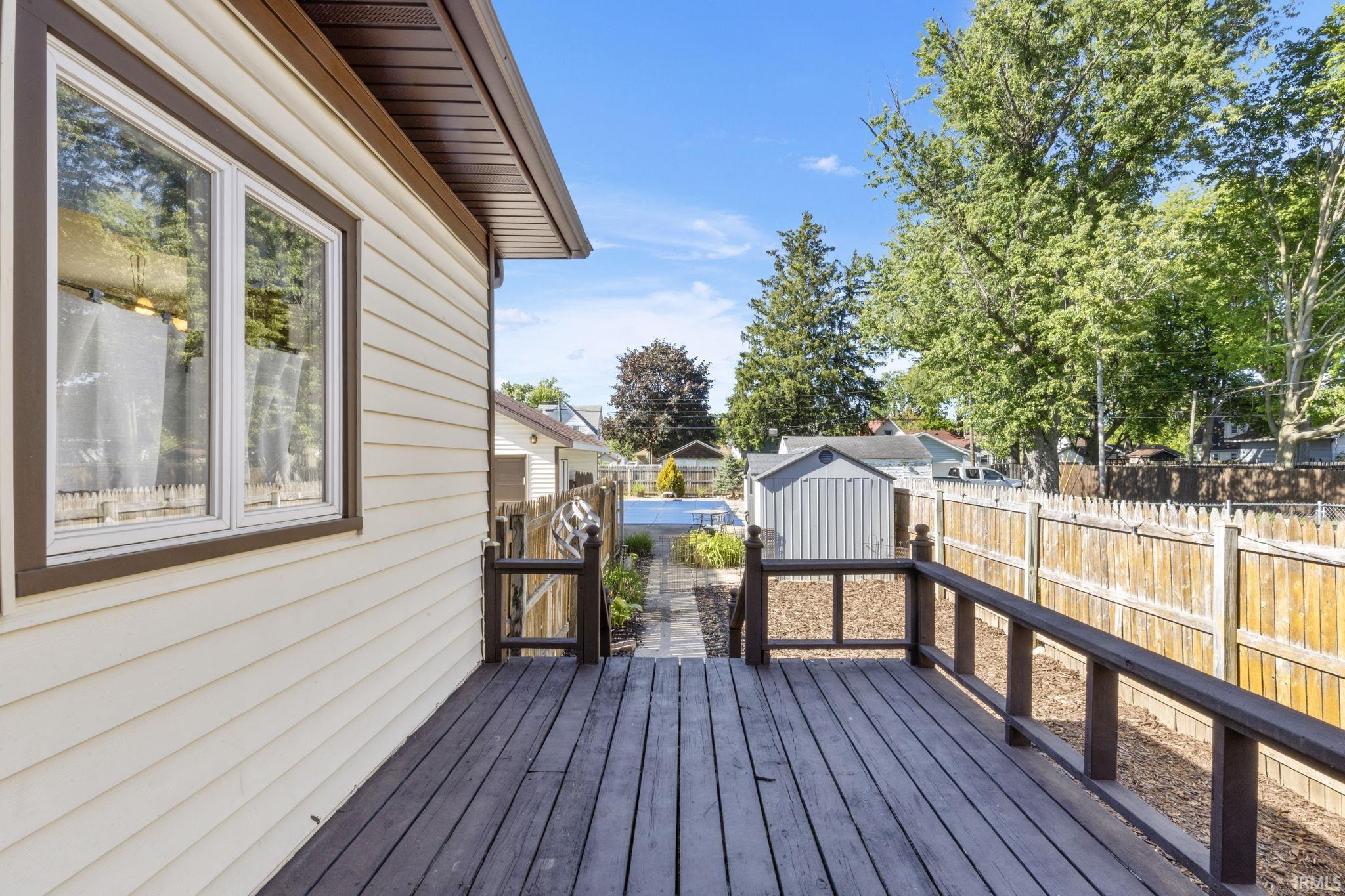 Exterior deck featuring wood-finish flooring and railing