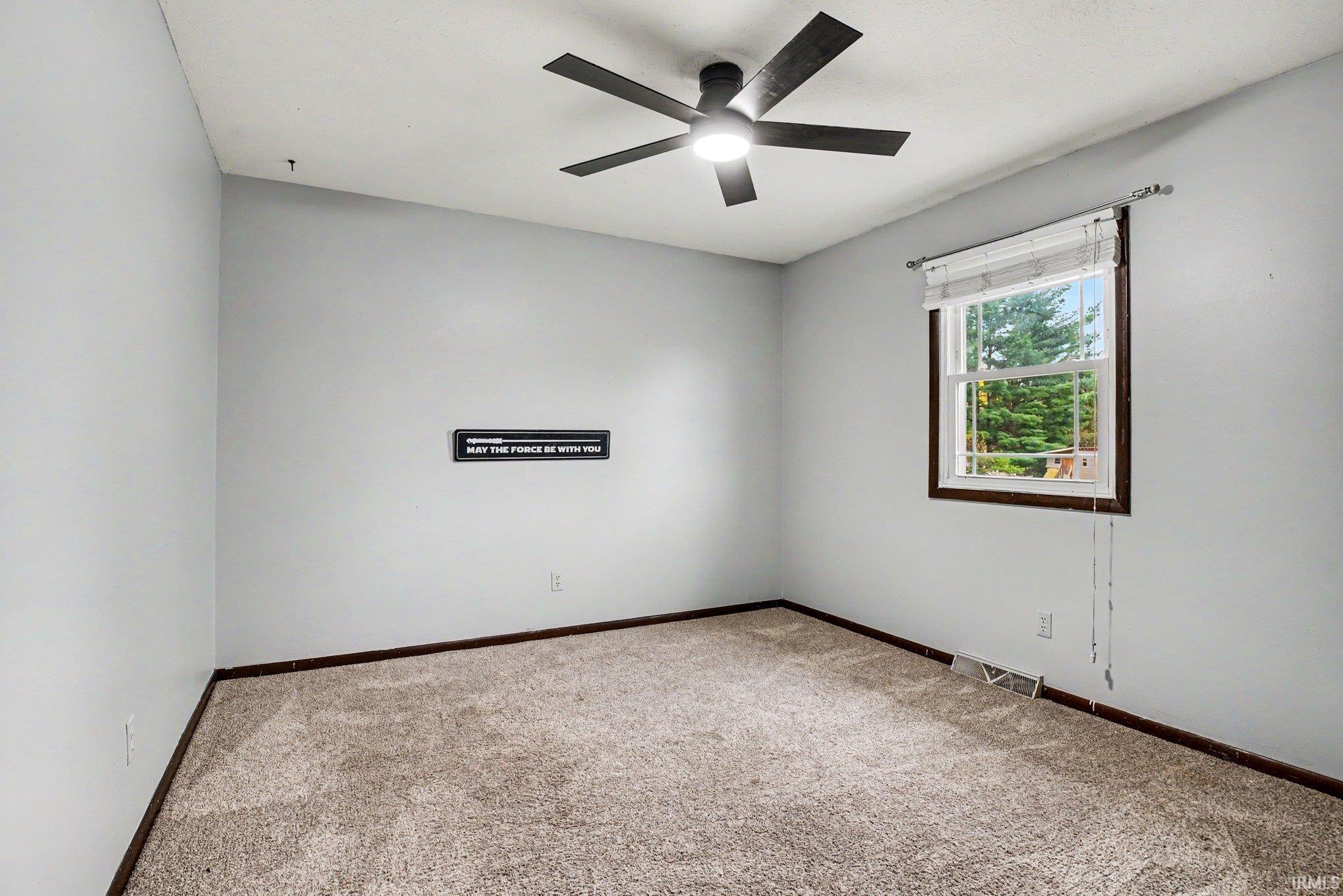 Neutral-toned carpeting paired with light gray walls