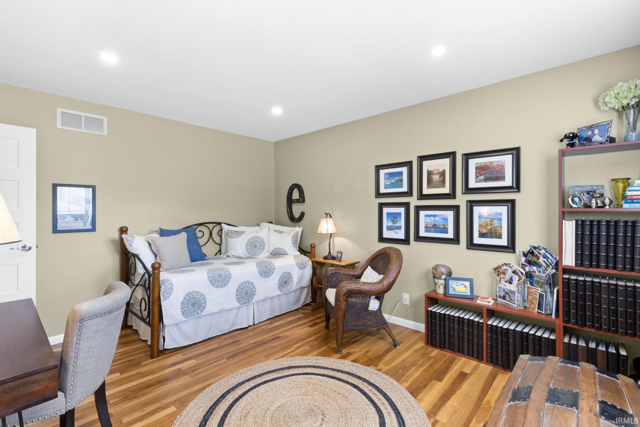 Hardwood-style flooring throughout this space with neutral wall tones