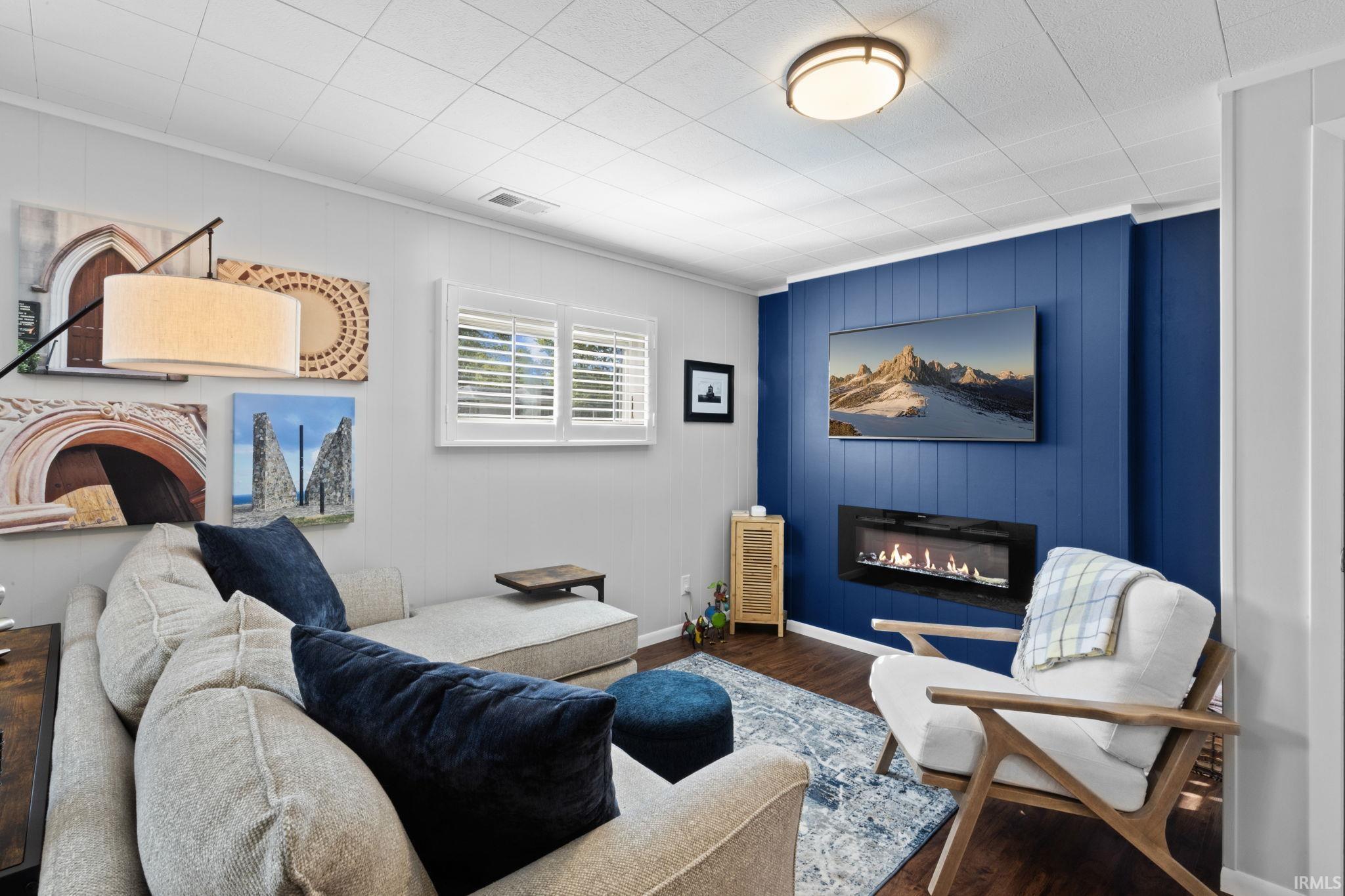 Living area featuring wood-finish flooring and light gray walls