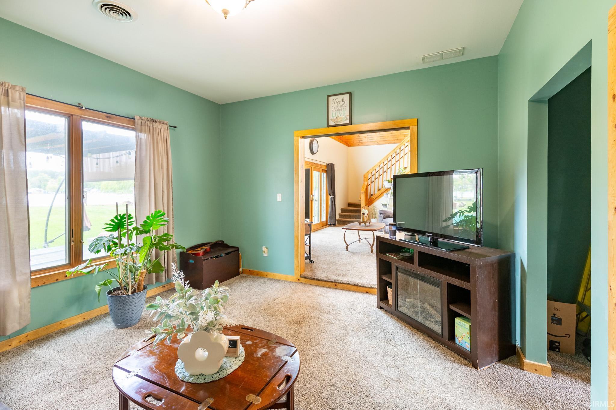 Inviting bedroom 2 featuring soft green walls and a plush carpet