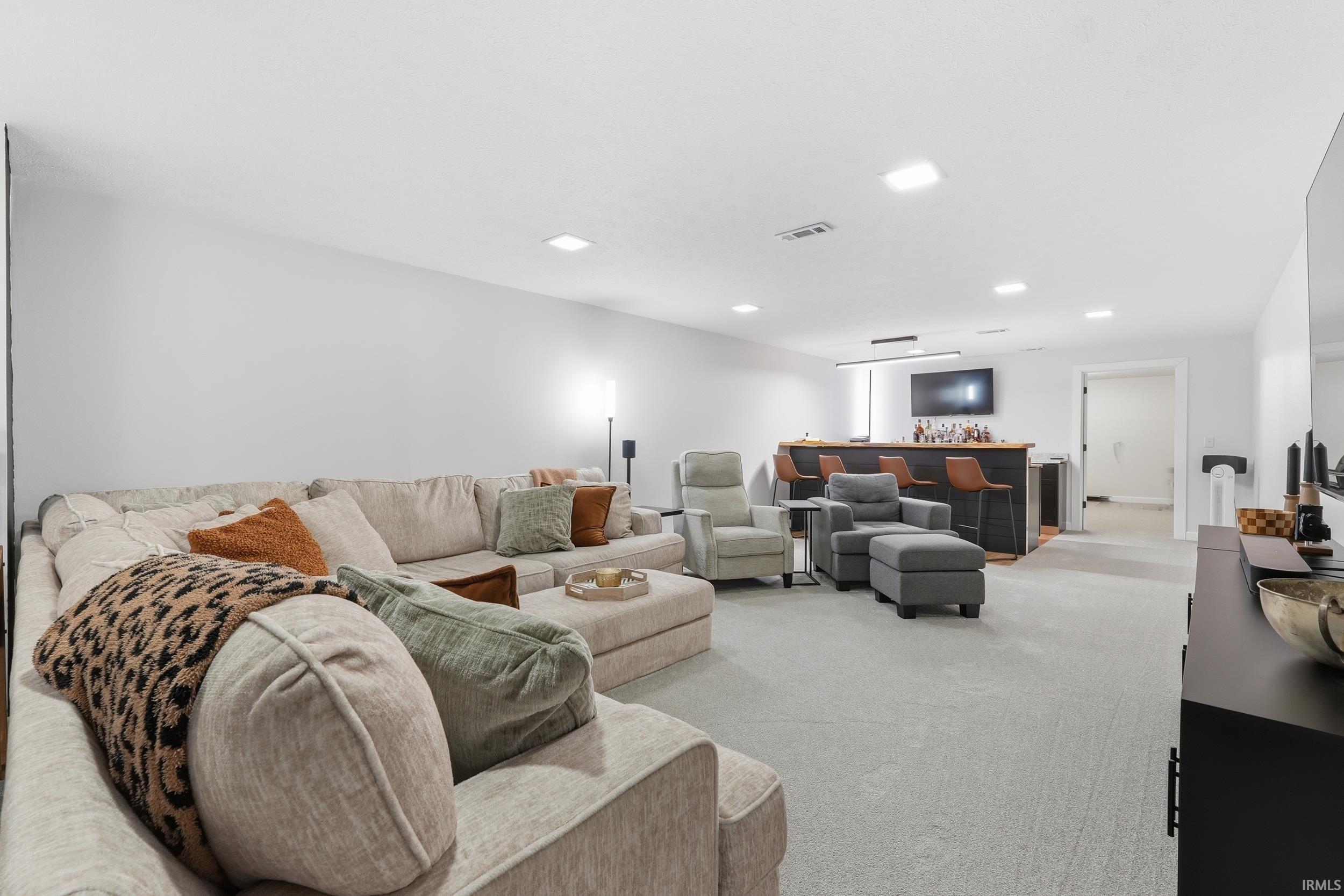 Living room featuring carpet and recessed lighting