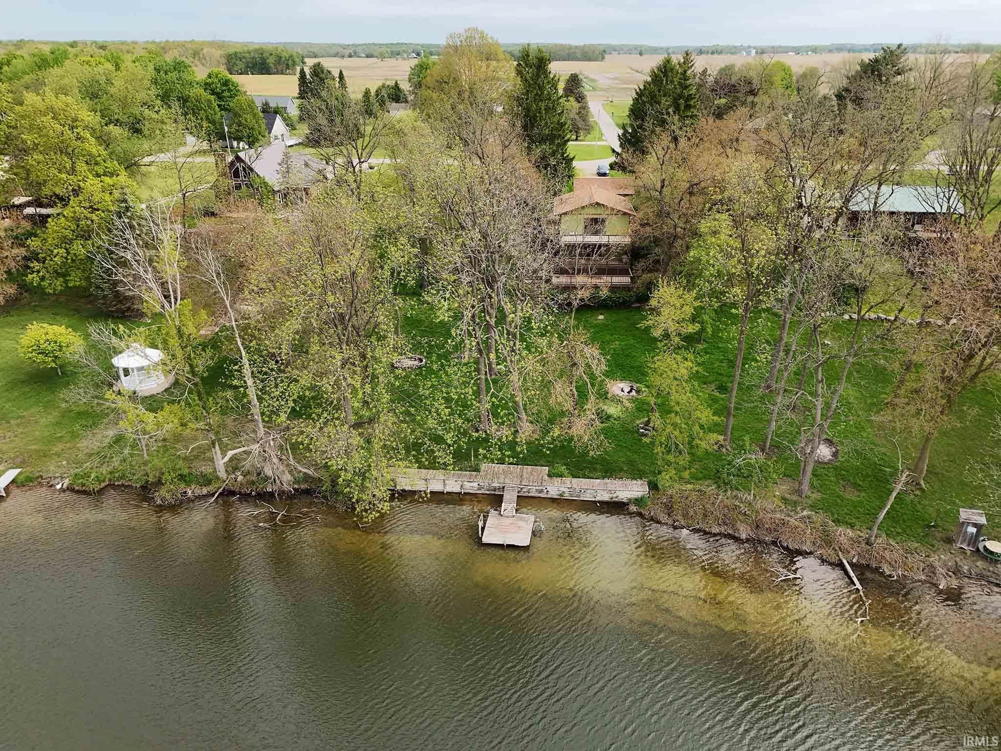 Aerial of home and frontage from lake.