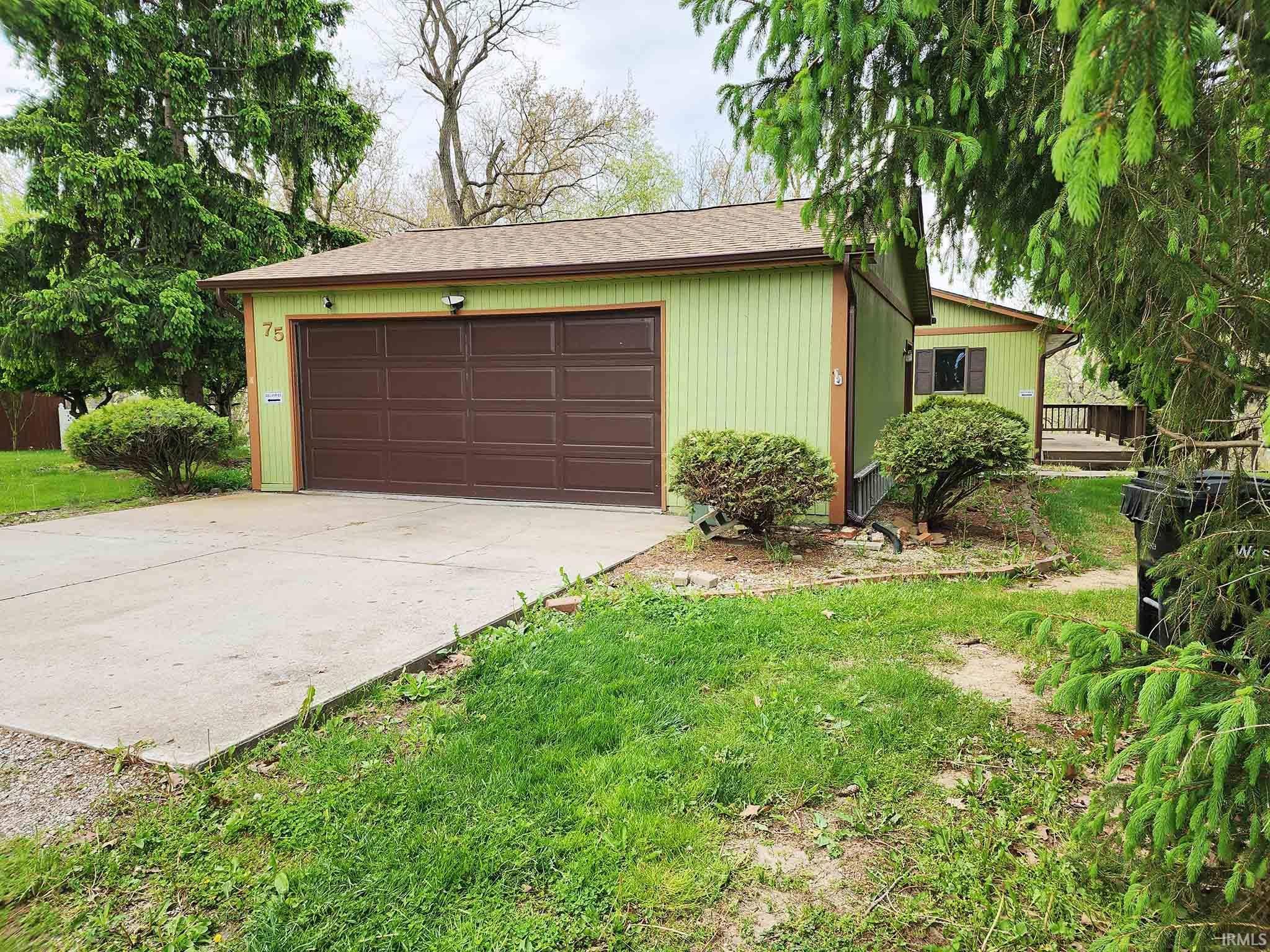 Closer view of garage and drive toward home.