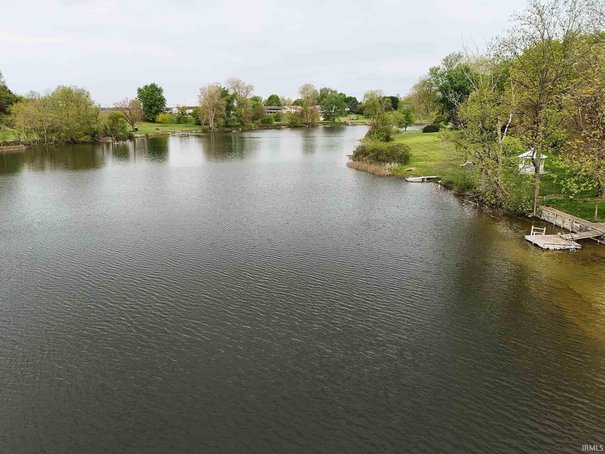 Aerial view of Gooseneck Lake with property to right.