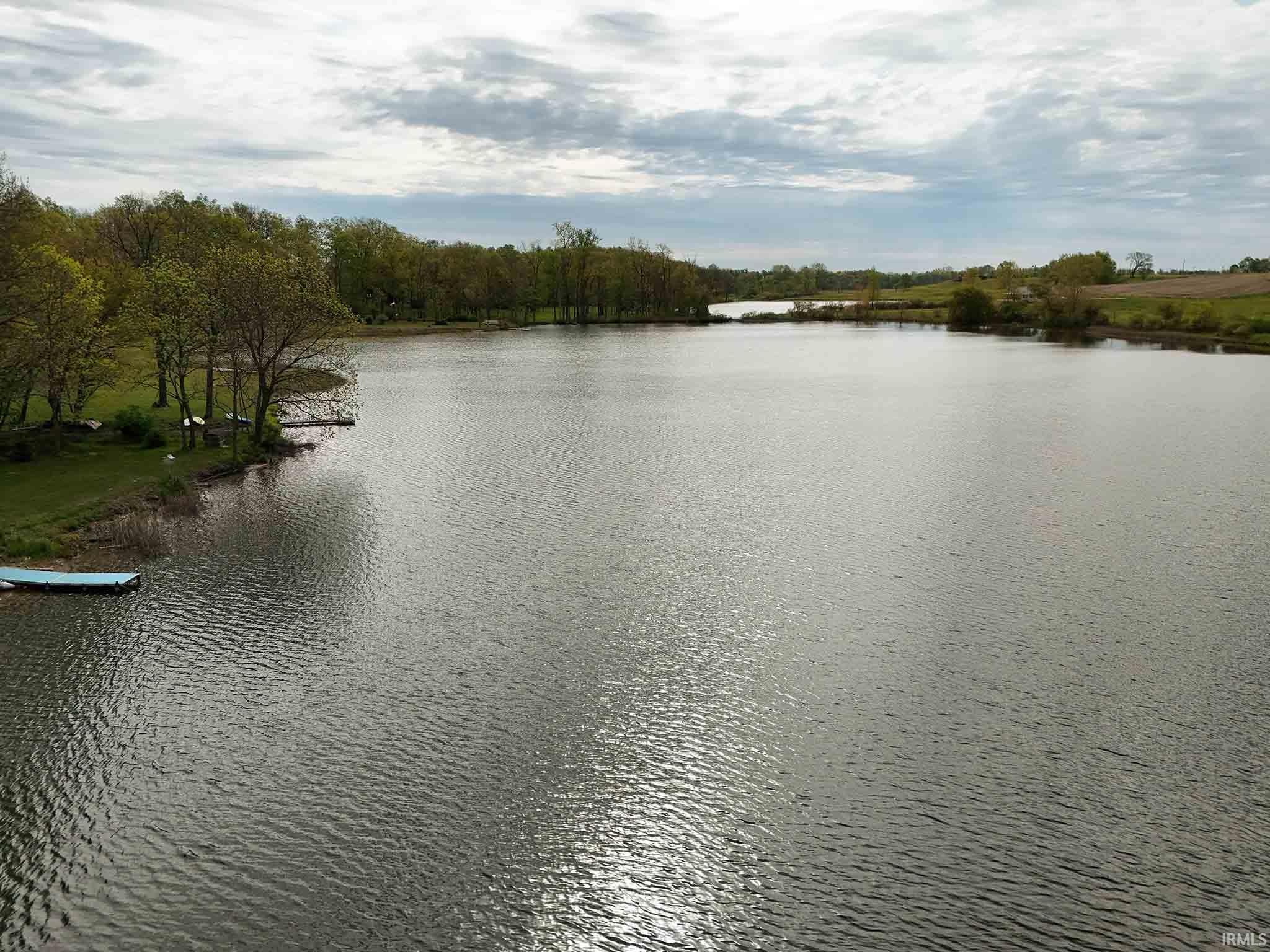 Aerial view of Gooseneck Lake with property to left.