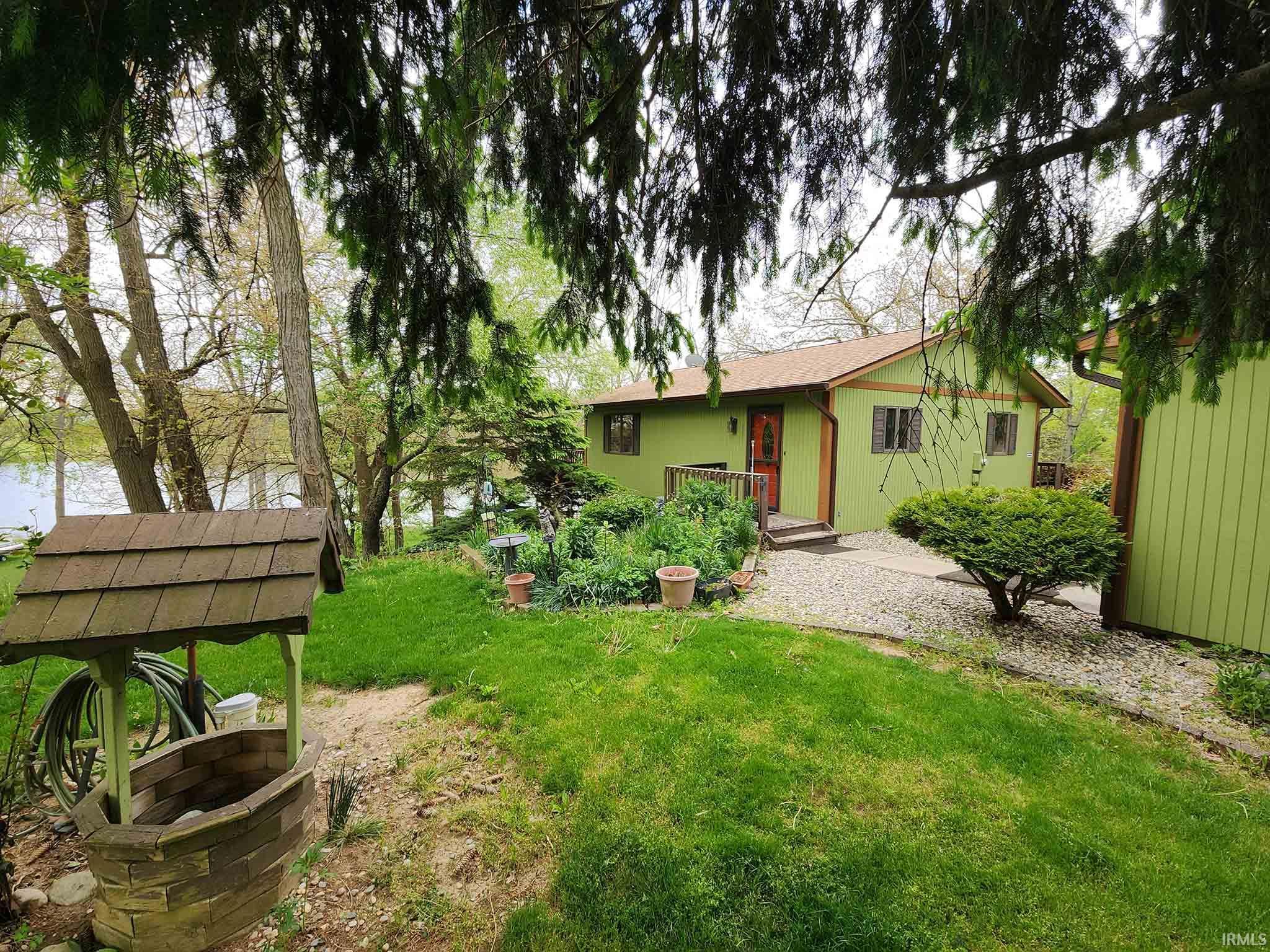 Home and side yard facing lake.