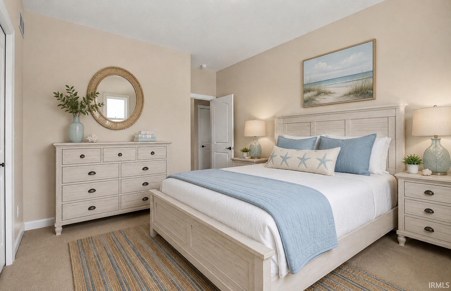 Bedroom featuring neutral wall color, carpet flooring, a white paneled door, and a built-in closet
