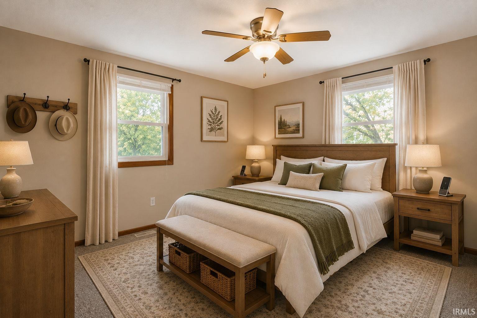 Carpeted bedroom featuring two windows with natural wood trim, a ceiling fan with integrated lighting, and a neutral color palette