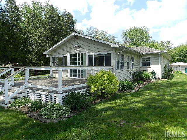 Exterior featuring light-colored siding and a multi-level deck with white railings