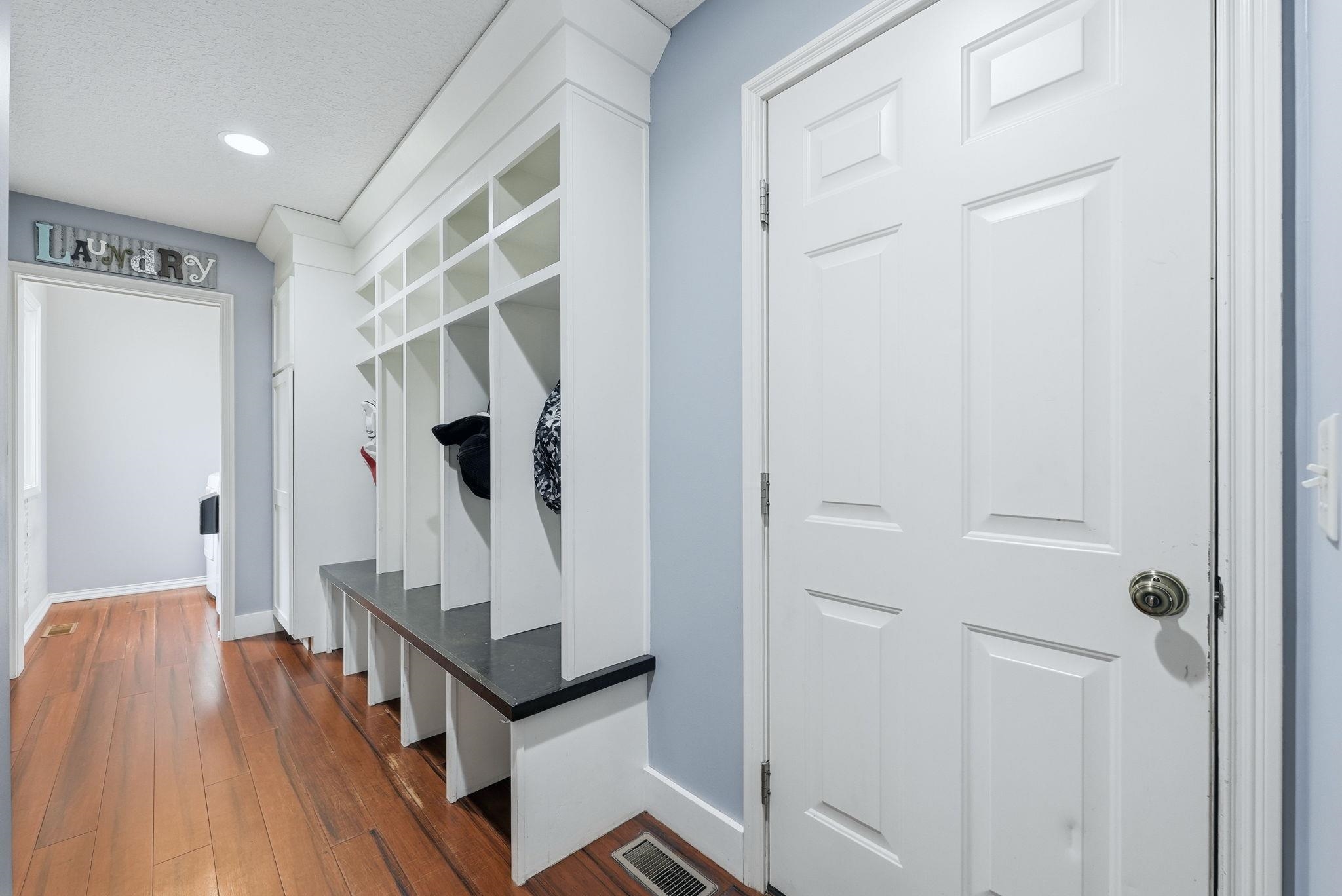 Built-in cubby storage with bench seating and dark-finish top
