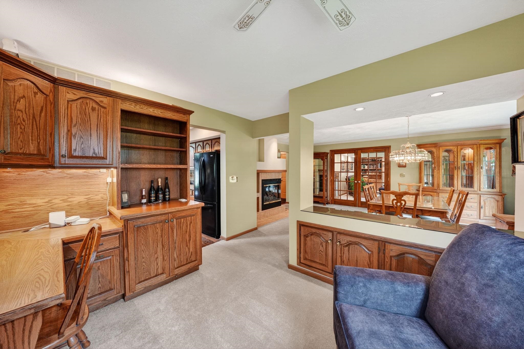 Built-in wood cabinetry with integrated desk space and shelving