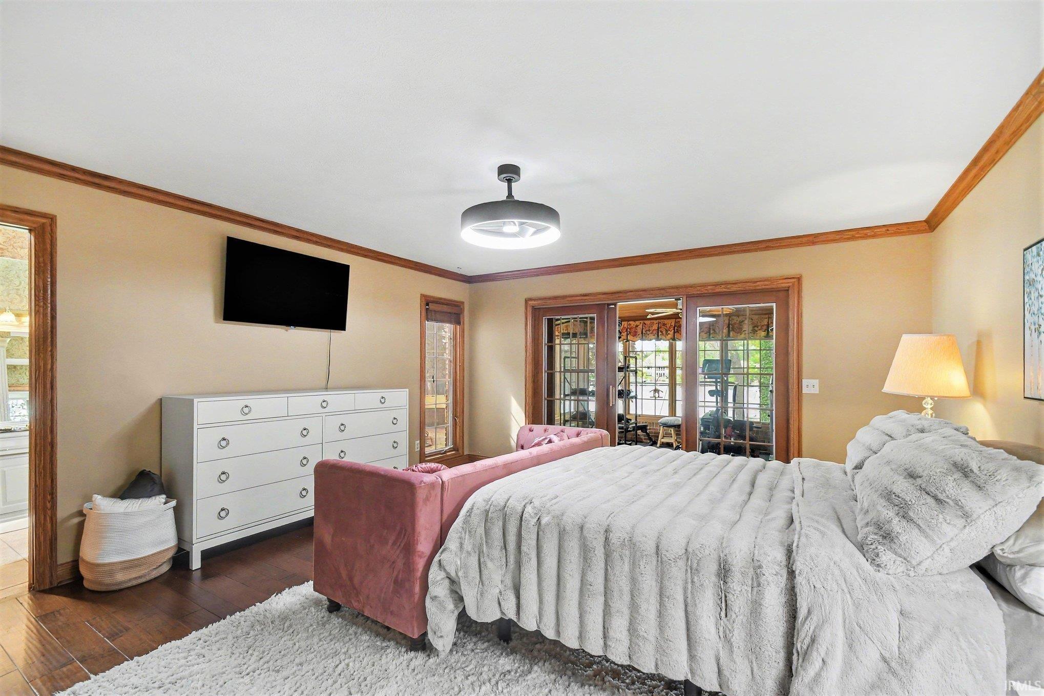Hardwood-finish flooring featuring an overhead ceiling light fixture
