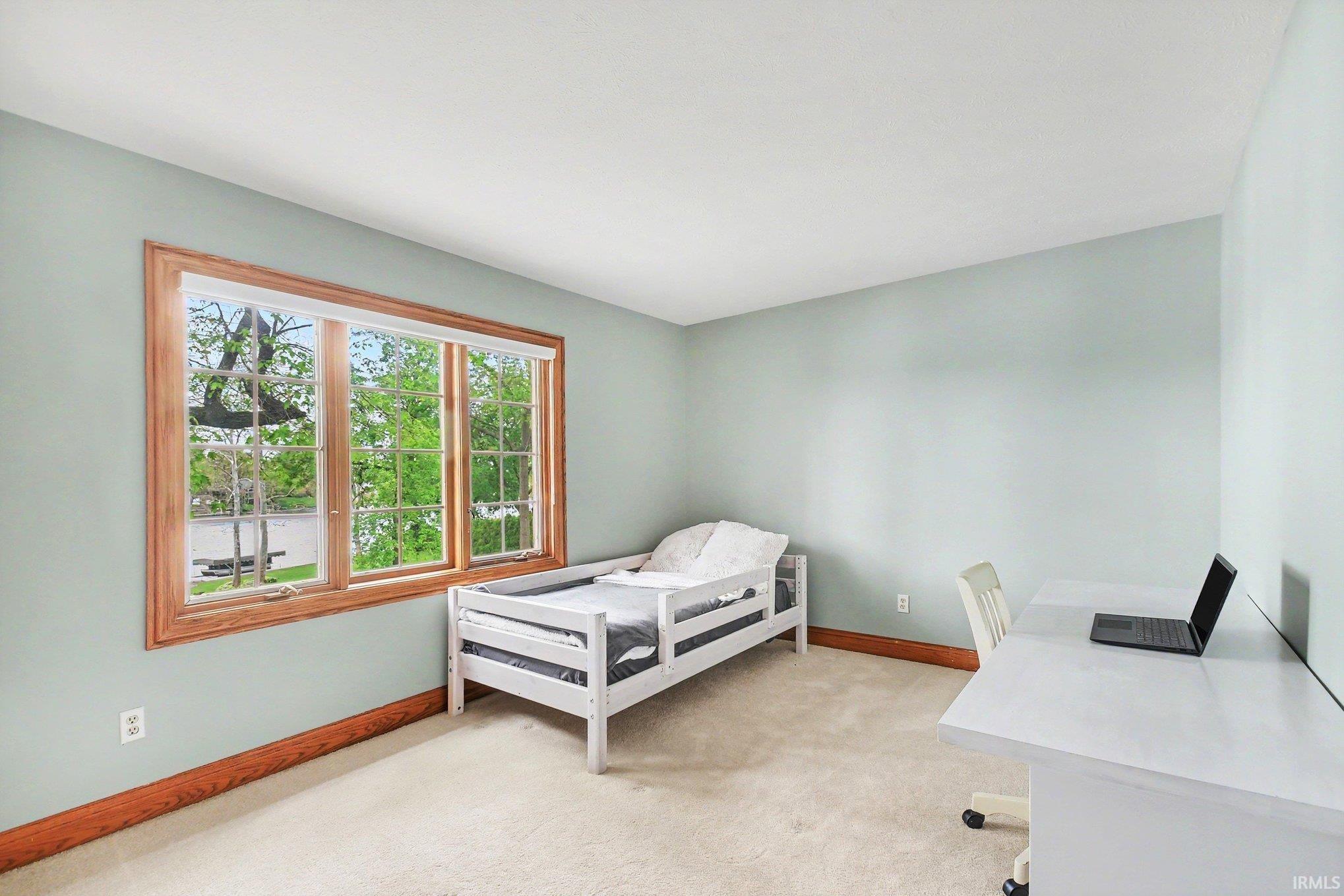 Expansive window with River Views, wood trim provides abundant natural light