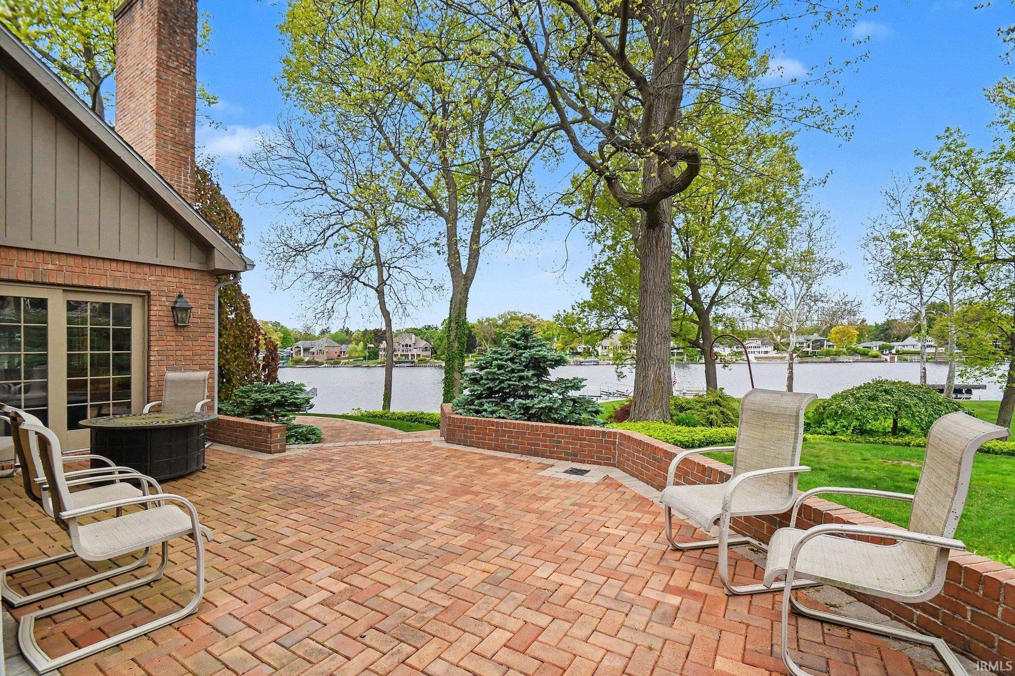 Expansive brick paver patio featuring a herringbone pattern