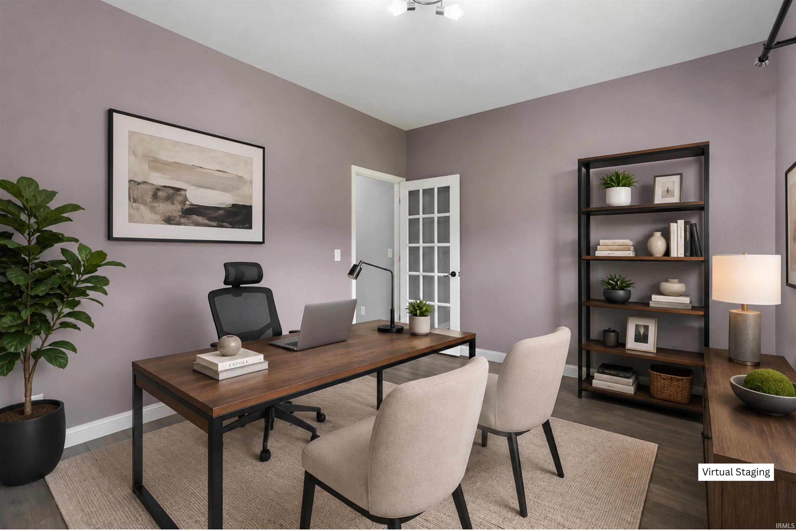 Spacious room featuring muted purple walls, wood-finish flooring, and a French door with multiple glass panes