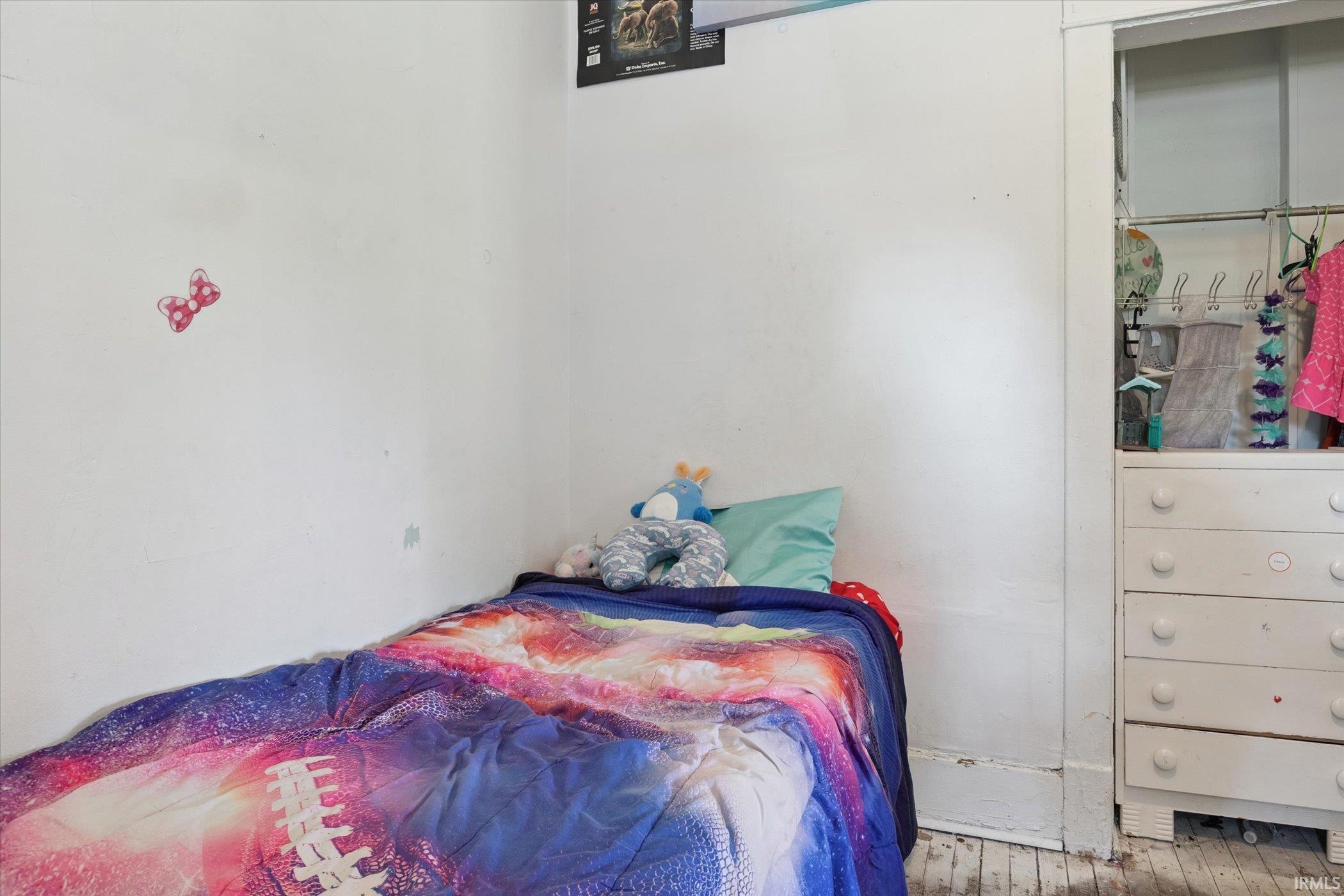 White painted walls framing a built-in dresser with five drawers