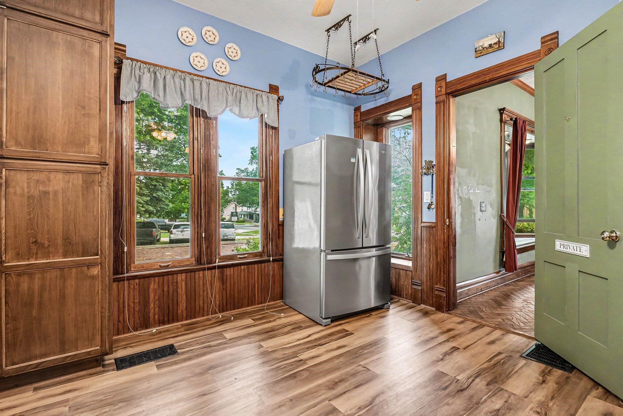 Wood-finish flooring with a stainless steel refrigerator