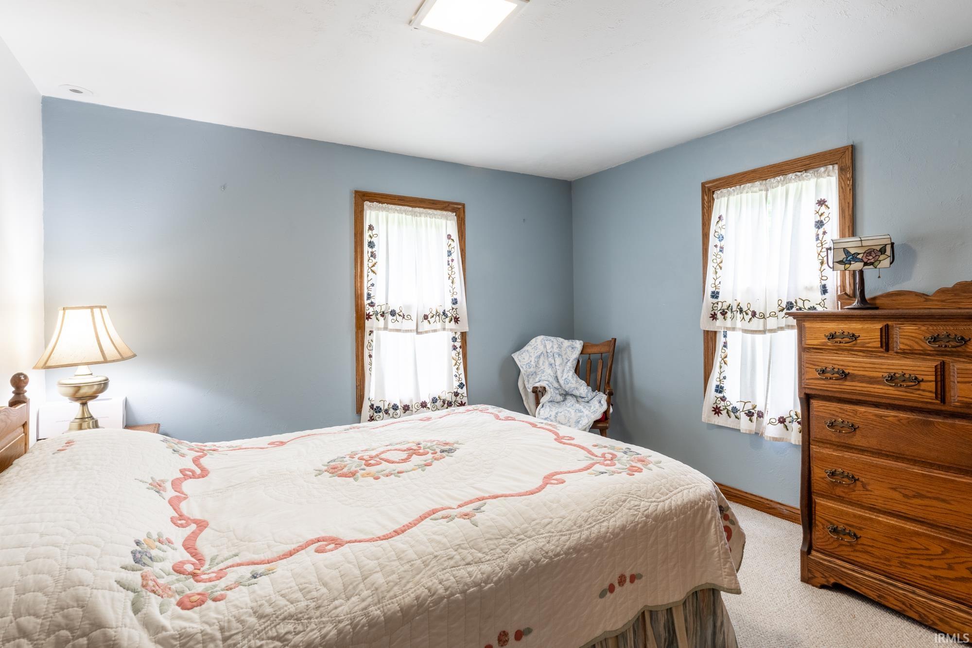 South west facing bedroom with cedar lined closet on the main level next to full bath