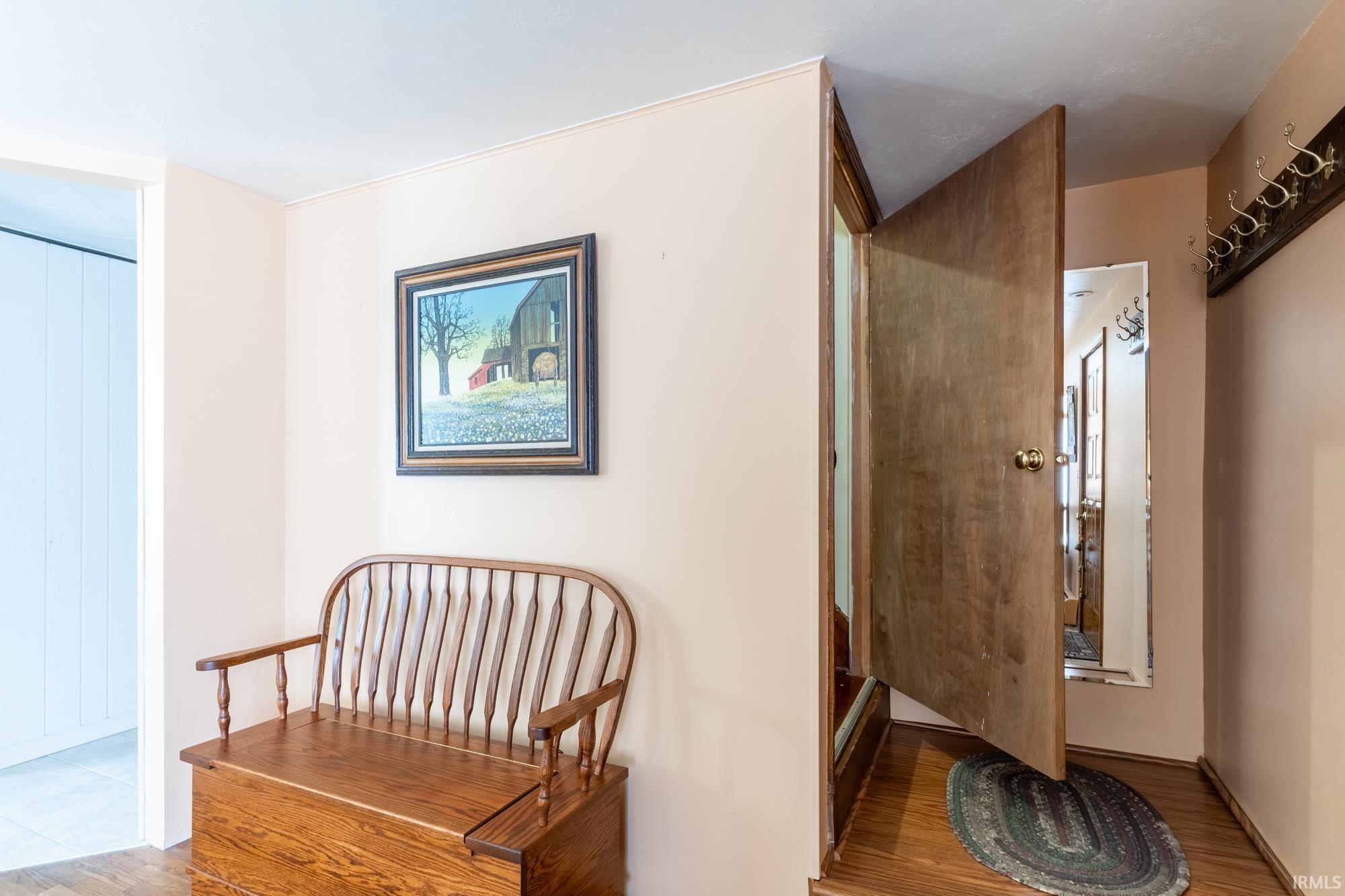 Hardwood-finish flooring throughout the entryway