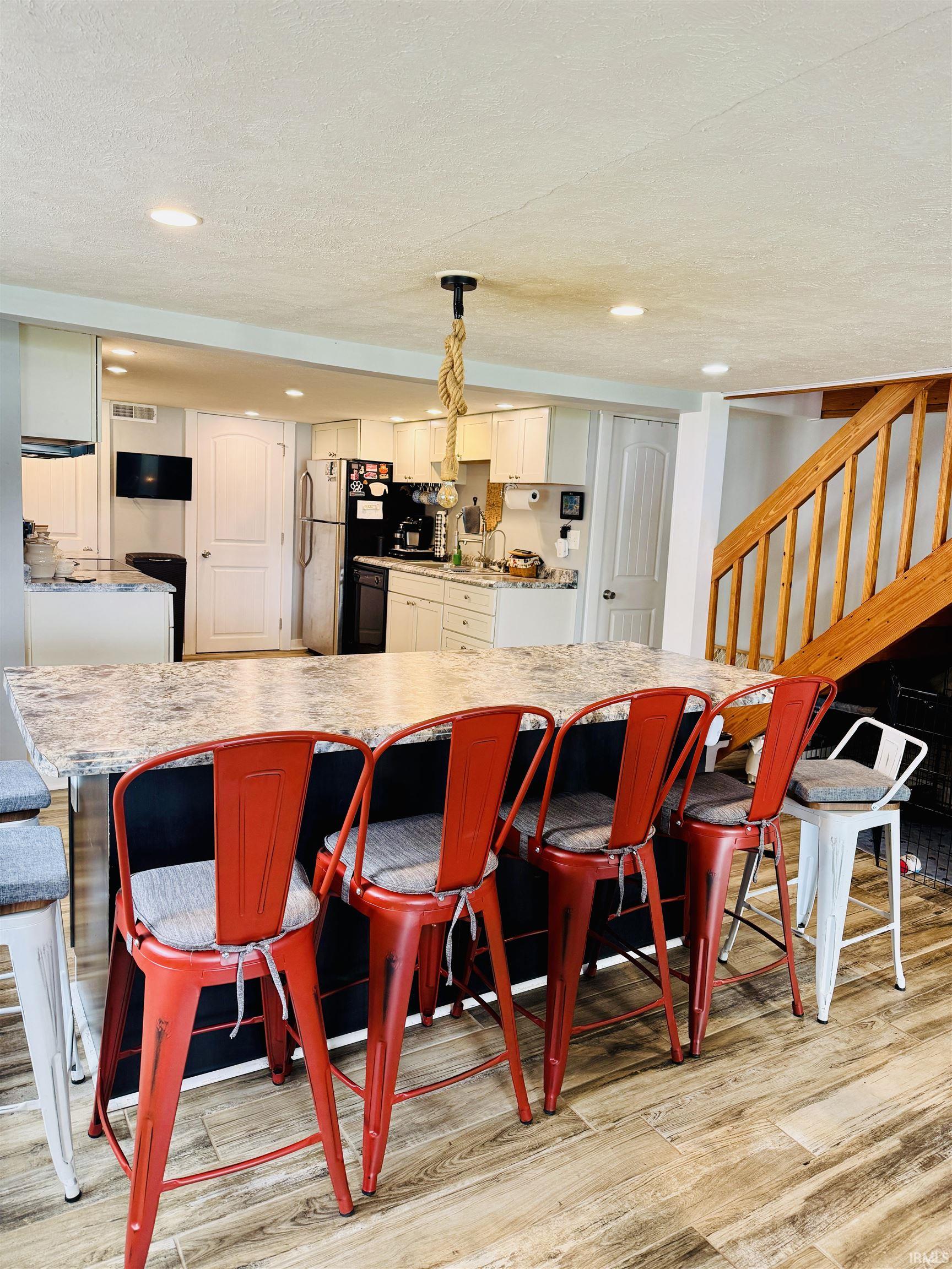 Kitchen island with a light-toned countertop and black base