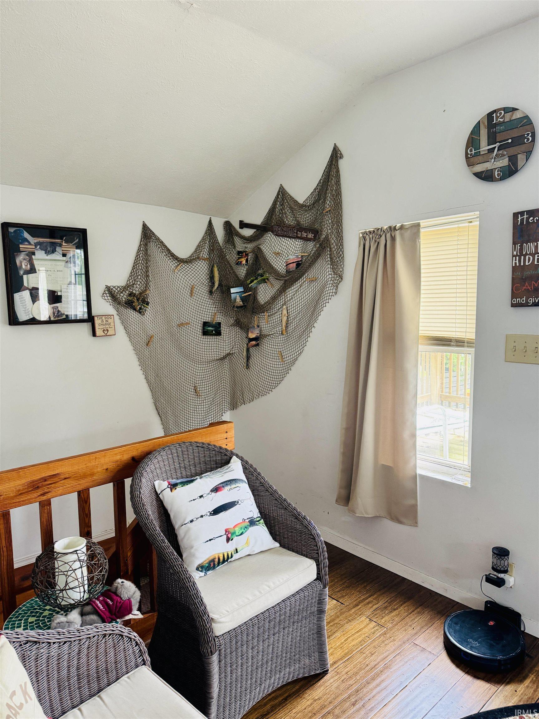 Vaulted ceiling over wood-finish flooring