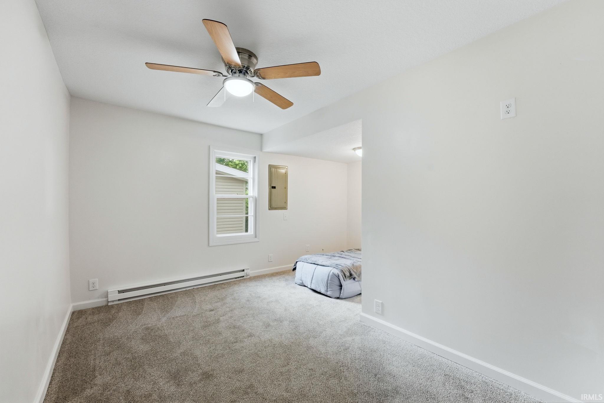 Interior room featuring neutral carpet and light-colored walls