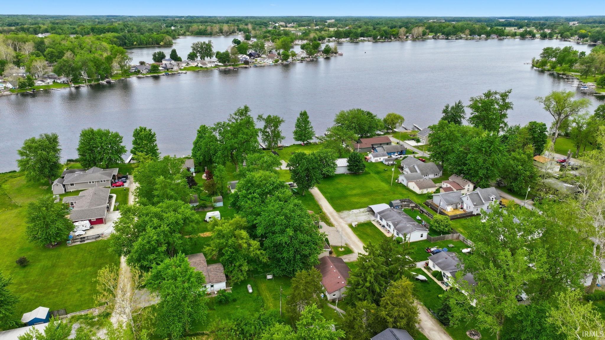 Waterfront properties with mature trees and green landscaping